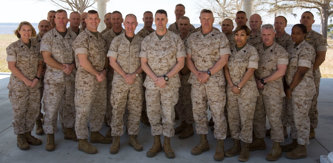 Brig. Gen. Robert F. Castellvi (center) and Sgt. Maj. Paul A. Berry (center right), the commanding general and incoming sergeant major of Marine Corps Installations East – Marine Corps Base Camp Lejeune, stand with other installation commanders and sergeants major during the Marine Corps Installations East Commander’s Conference, a two-day event held at the Paradise Point Officers’ Club aboard Camp Lejeune, March 26 and 27. The conference provides an avenue for leaders to gather and discuss matters pertaining to the seven East Coast installations that fall under MCIEAST. Leaders walk away with a level of common understanding of the circumstances, conditions and intentions of the command over the next six to 12 months.