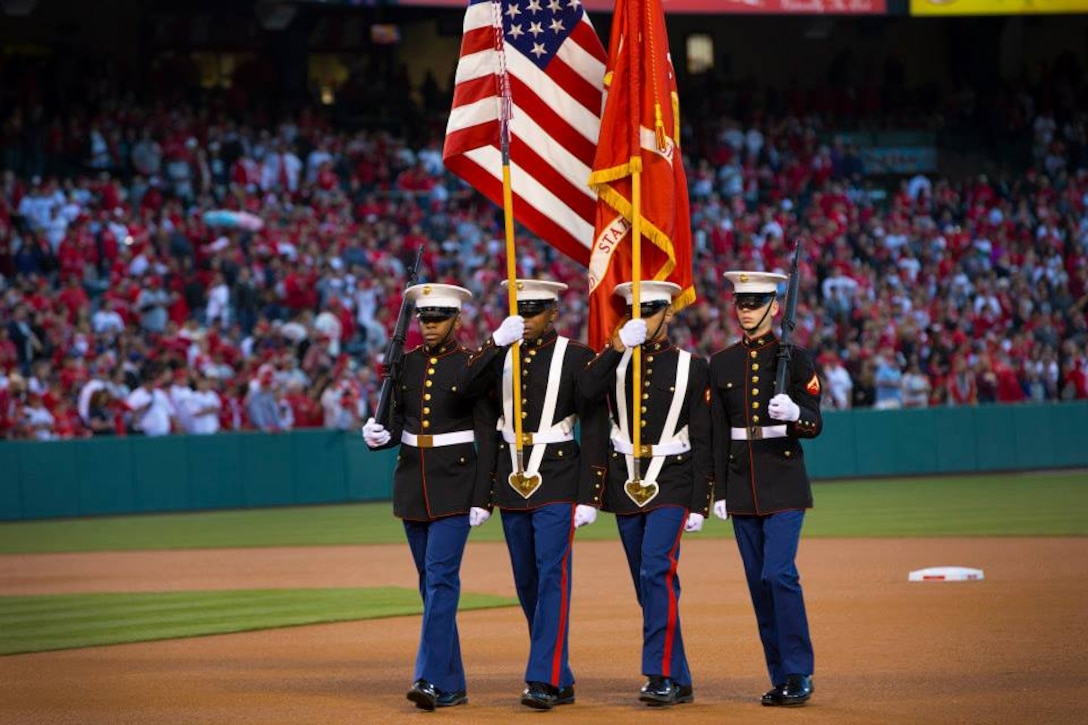Headquarters and Support Battalion Color Guard from Marine Corps Base Camp Pendleton, march back to the staging area after presenting the colors during the national anthem at the opening game for the Anaheim Angels March 31. For more information on how to request armed forces support at your eligible community event, please contact the Marine Corps Installations West- Marine Corps Base Camp Pendleton community relations chief at (760) 725-5569.