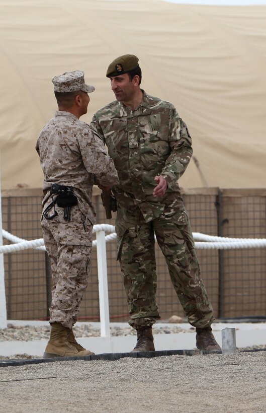 Brigadier Gen. Daniel Yoo, left, commander of Regional Command (Southwest), shakes hands with Brigadier James Woodham, commander of Task Force Helmand, as a symbol of Task Force Helmand’s merge with Regional Command (Southwest) during a ceremony aboard Camp Bastion, Afghanistan, April 1, 2014. Following eight years of combat operations in Helmand province, the ceremony marked the end of the United Kingdom’s military headquarters in southwestern Afghanistan. The functions of the British headquarters element now reside with RC(SW). The task force was established in April 2006 and has conducted 16 rotations since its beginning.



