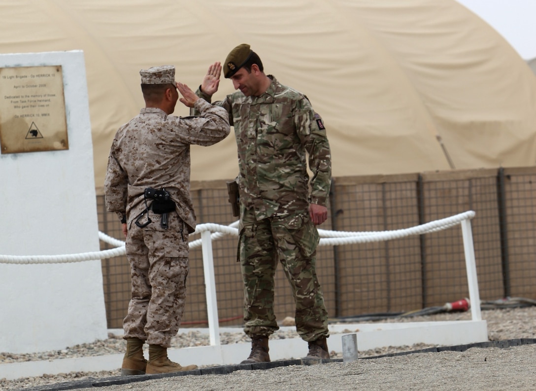 Brigadier James Woodham, right, commander of Task Force Helmand, gives the final salute to Brigadier Gen. Daniel Yoo, commander of Regional Command (Southwest), symbolizing the closure of Task Force Helmand during a merger ceremony for the task force and RC(SW) aboard Camp Bastion, Afghanistan, April 1, 2014. Following eight years of combat operations in Helmand province, the ceremony marked the end of the United Kingdom’s military headquarters in southwestern Afghanistan. The functions of the British headquarters element now reside with RC(SW). The task force was established in April 2006 and has conducted 16 rotations since its beginning.




