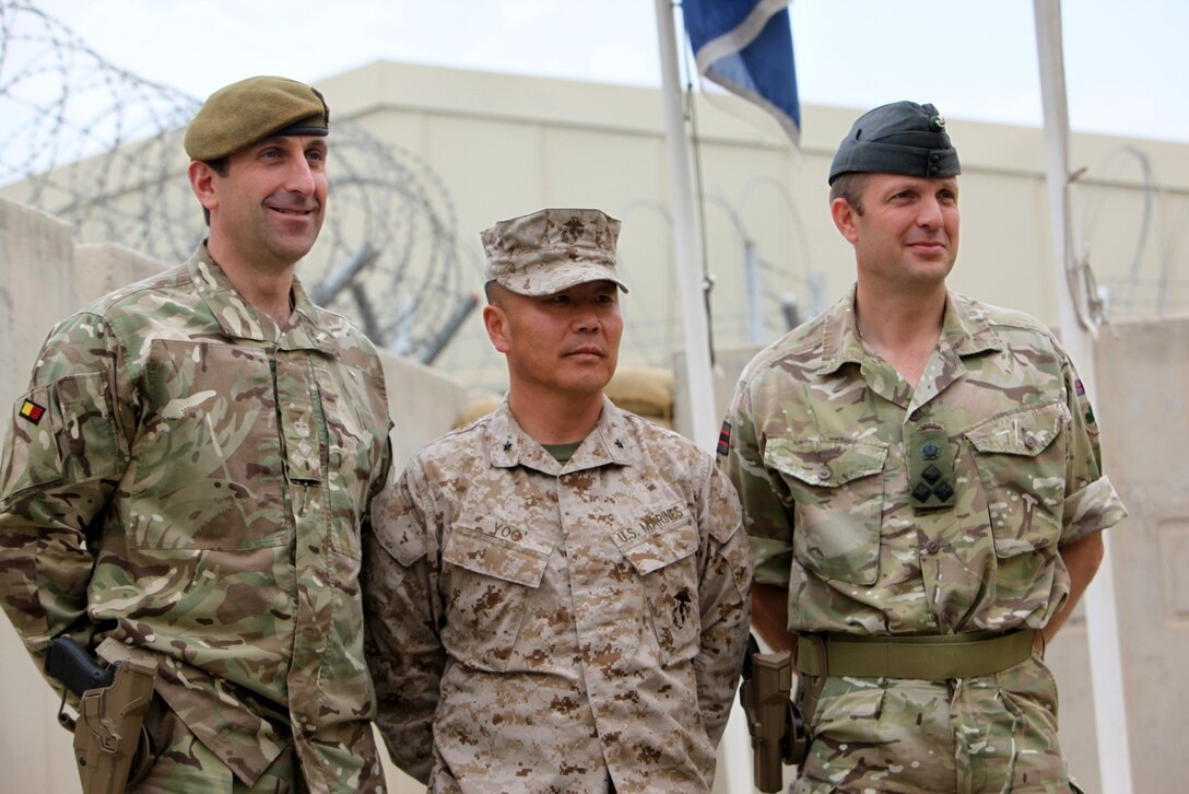 From left to right: Brigadier James Woodham, commander of Task Force Helmand; Brigadier Gen. Daniel Yoo, commander of Regional Command (Southwest); and Brig. Robert Thompson, deputy commander of RC(SW), pose for a photo after a Task Force Helmand and RC(SW) merger ceremony aboard Camp Bastion, Afghanistan, April 1, 2014. Following eight years of combat operations in Helmand province, the ceremony marked the end of the United Kingdom’s military headquarters in southwestern Afghanistan. The functions of the British headquarters element now reside with RC(SW). The task force was established in April 2006 and has conducted 16 rotations since its beginning.




