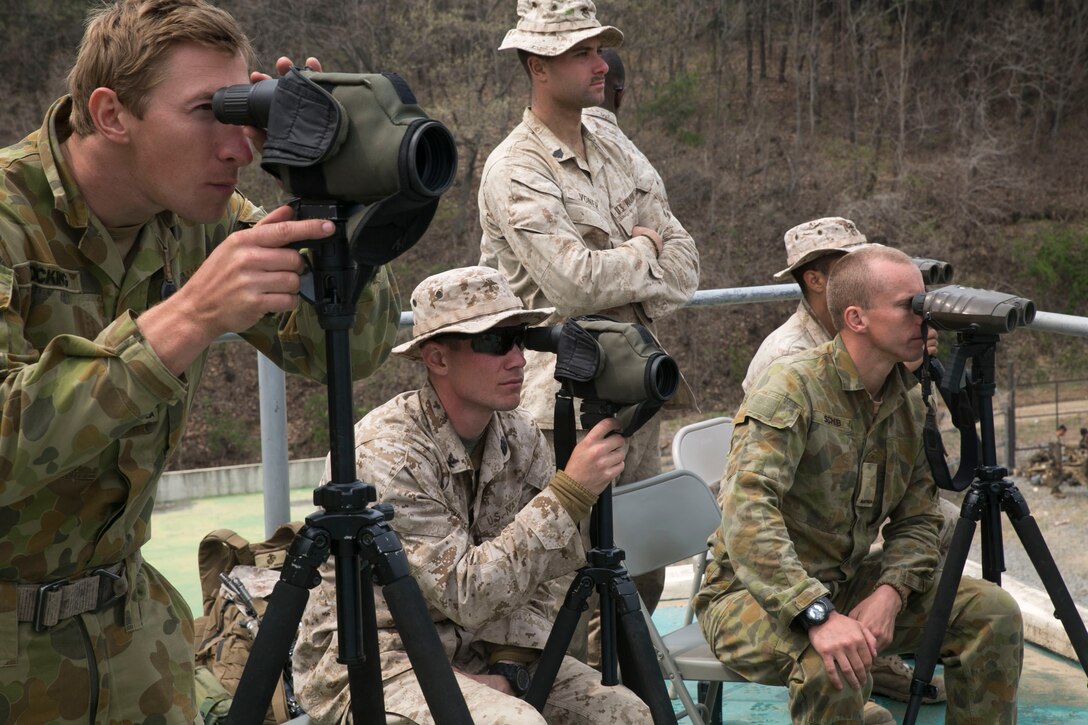 Australian soldiers and U.S. Marines stand watch for snipers creeping through dense wooded areas and thick brush during a sniper stalking course April 3 during Ssang Yong 2014 at an urban combat training site in Pohang, Republic of Korea. Ssang Yong 14 conducted annually by Marine and Navy Forces with the ROK to strengthen the wide range of military operations, such as disaster relief to complex, expeditionary operations. The Australian soldiers are with 6th Battalion, 6th Royal Australian Regiment. The U.S. Marines are with Scout Sniper Platoon, Weapons Company, 2nd Battalion, 3rd Marine Regiment, 3rd Marine Division. (U.S. Marine Corps photo by Lance Cpl. Cedric R. Haller II/RELEASED)