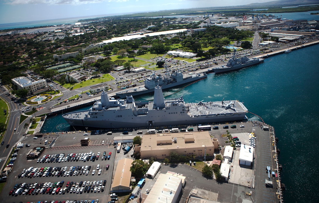 An MV-22 Osprey with Marine Medium Tiltrotor Squadron 161 (VMM-161) flies over USS Anchorage docked at Joint Base Pearl Harbor-Hickam, April 2. The squadron demonstrated the capabilities of the Osprey for Association of Southeast Asian Nations defense ministers, who were here for the U.S.-ASEAN Defense Forum. ASEAN is a political and economic organization of ten countries, which aims to accelerate economic growth, social progress, cultural development amongst its members, protection of regional peace, stability, and opportunities for member countries to discuss differences peacefully.