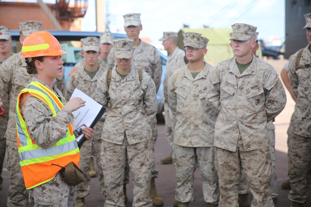 1st Lt. Emily Kay, logistics officer with Logistics Combat Element, Marine Rotational Force – Darwin gives a safety brief to Marines participating in the offload and transportation of MRF-D gear from the USNS 2nd Lt. John P. Bobo to Robertson Barracks and Royal Australian Air Force’s Base Darwin, March 31. As of early April, MRF-D will be at full capacity, wasting no time to begin the six-month rotation alongside the ADF and Darwin community for the extent of the Dry Season.