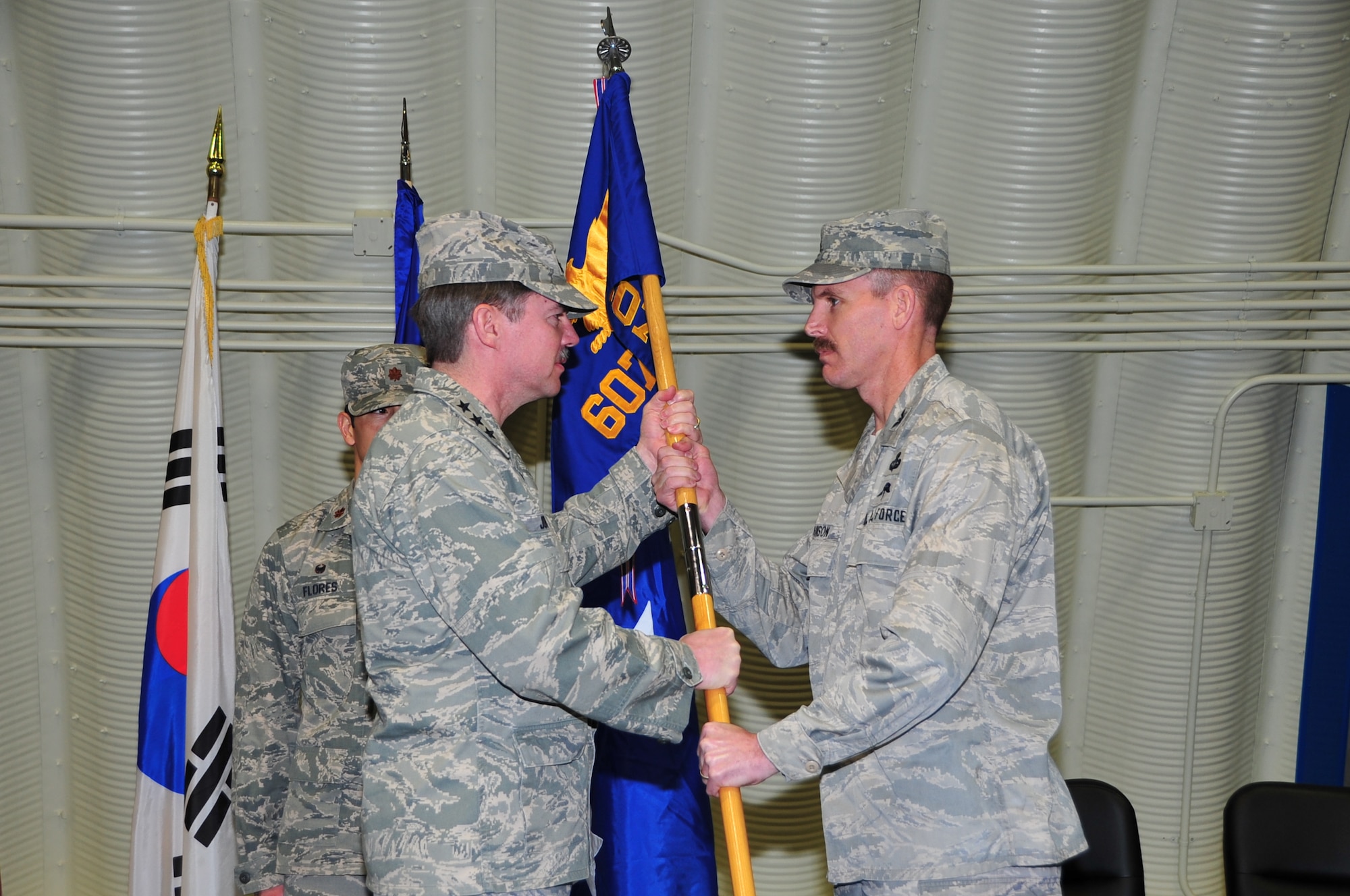 DAEGU AIR BASE, Republic of Korea - Lt. Gen. Jan-Marc Jouas, 7th Air Force commander, presents the 607th Materiel Maintenance Squadron guidon to Col. James Johnson, 607th Air Support Operations Group commander, during the squadron's change of responsibility ceremony on Daegu Air Base, Republic of Korea, March 28, 2014. Under the new alignment, the 607th MMS falls under the 607th ASOG, with the 607th MMS commander answering the 607th ASOG commander rather than directly to the 7th AF staff. (U.S. Air Force photo by Tech. Sgt. Thomas J. Doscher)