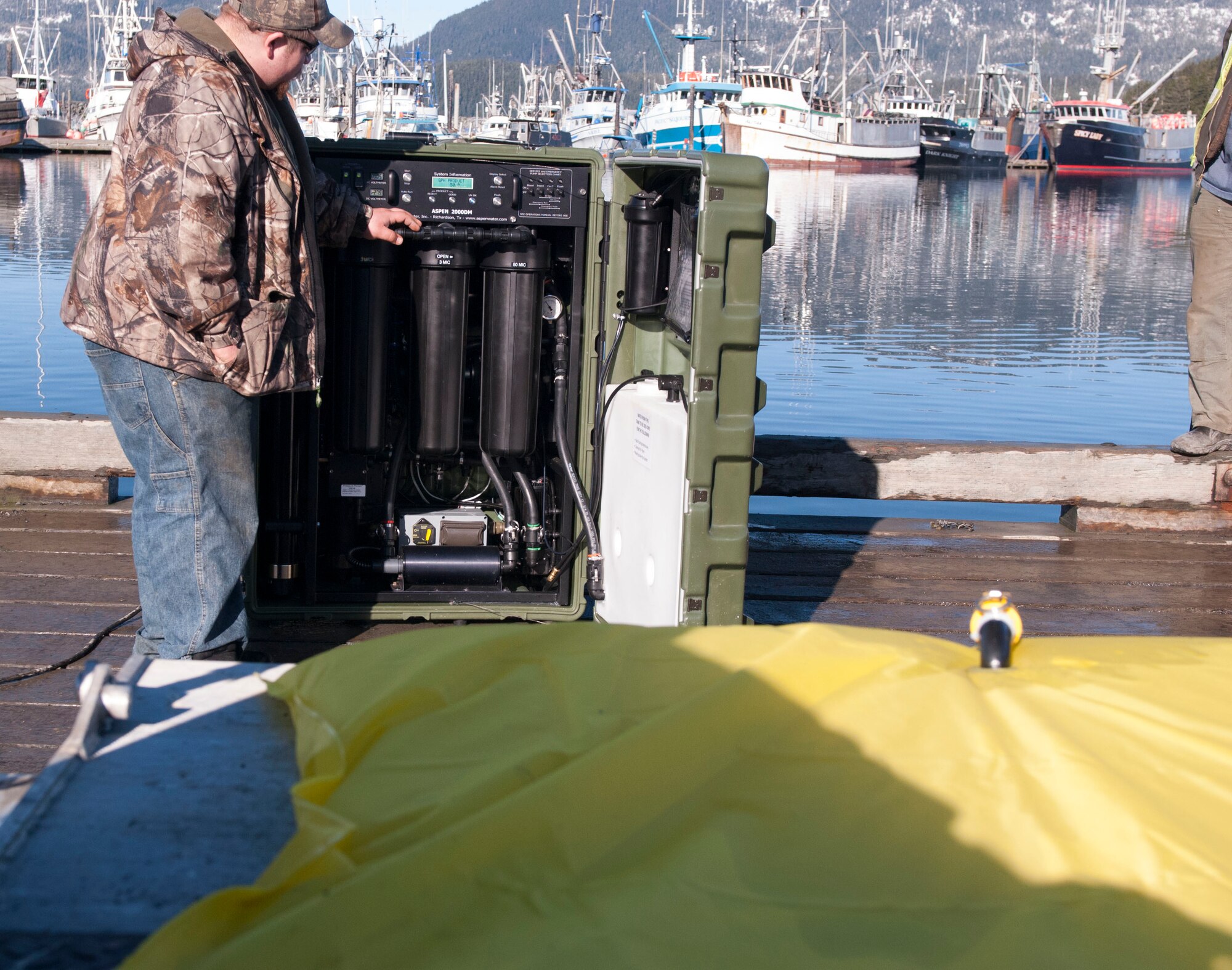 This desalinization pump takes salt water from the port and converts it into potable water that is then pumped into the yellow bag for transport to the Point of Distribution at Alaska Shield 14 here on March 29, 2014. Alaska Shield 14 is an exercise that involves state, federal, military and local agencies, designed to test the response and coordination of the disaster modeled after the 1964 earthquake and subsequent tsunami that devastated much of south central Alaska including the city of Cordova. (U.S. Army photo by Spc. Lindsey Schulte)