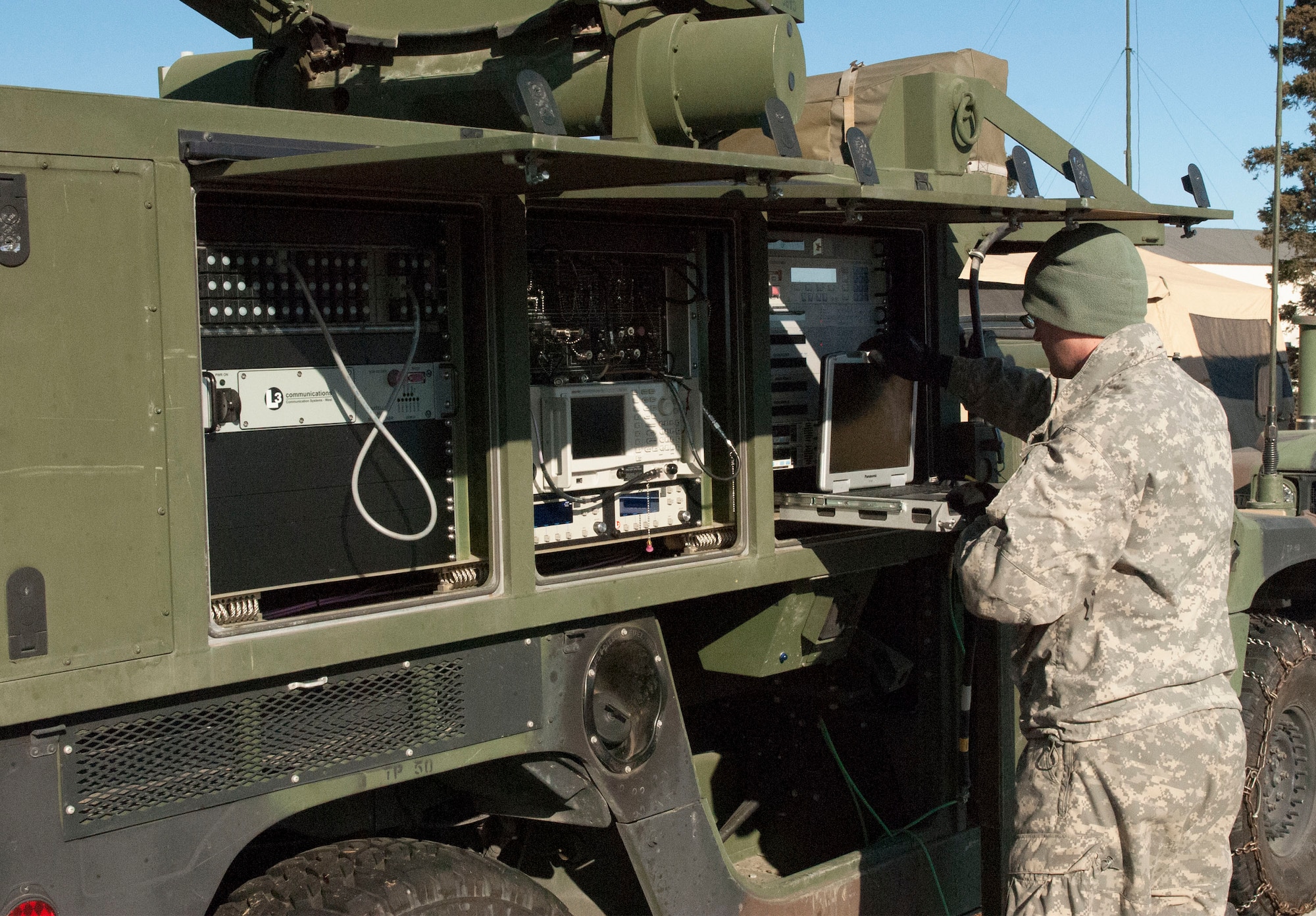 Spc. Joel A. Resler, with the 59th Signal Battalion sets up an AN/TSC-156 Phoenix satellite here during Alaska Shield 14, April 2, 2014. The 59th was tasked to reestablish communications after a black-out occurred during the exercise. Alaska Shield 14 is an exercise that involves federal, state, local and military agencies, designed to test response and coordination efforts during a disaster and is modeled after the 1964 earthquake and subsequent tsunami that devastated Alaska. (U.S. Army photo by Spc. True Thao)