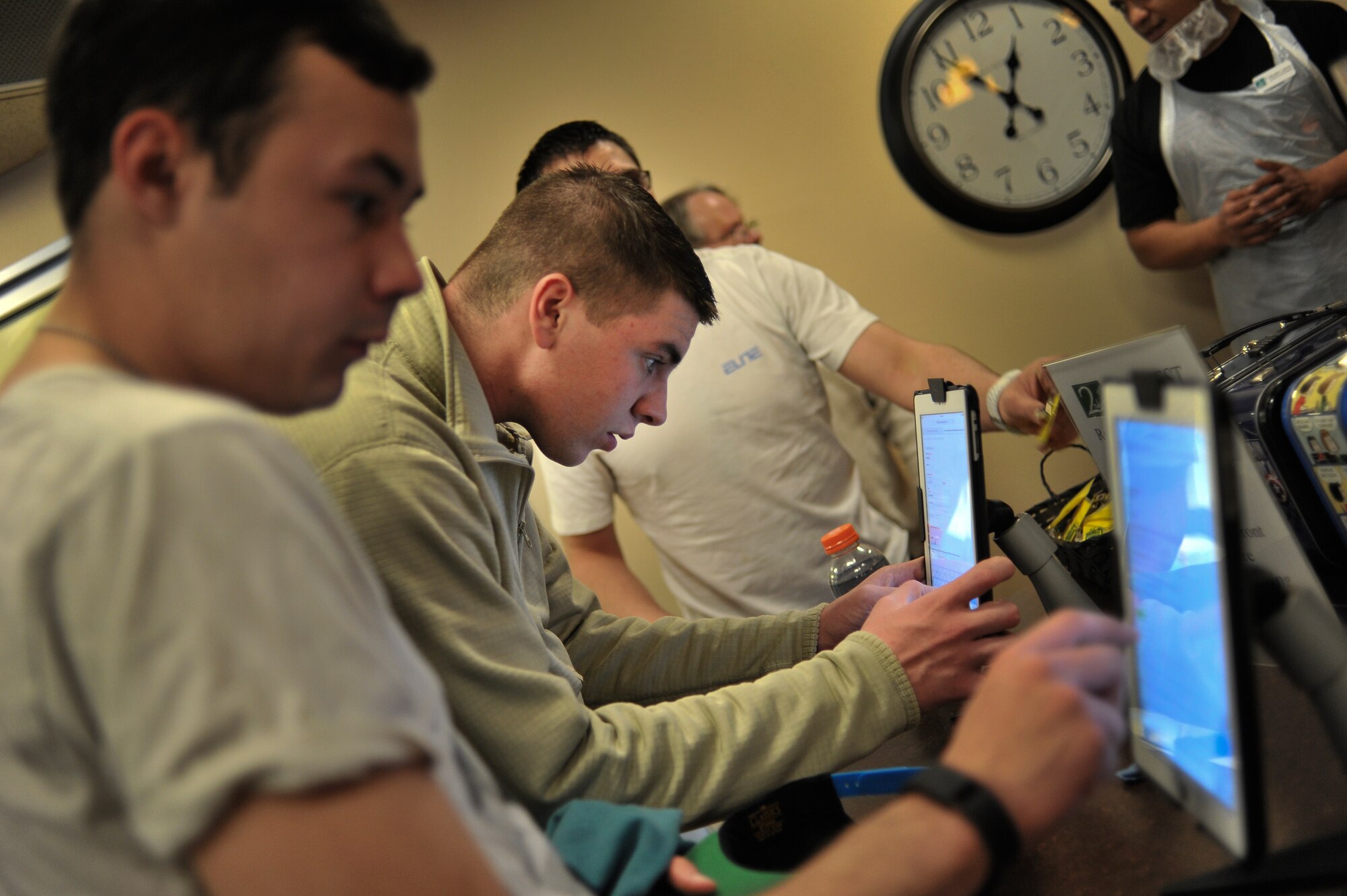 Students from the 66th Training Squadron register to begin volunteer work at Second Harvest Relief Network Spokane, Wash. March 31, 2014. Second Harvest has been serving the local community since 1971. Airmen from Fairchild have helped throughout the years to provide more than 2 Million pounds of food for families in 250 neighborhoods each year. (U.S. Air Force photo by Staff Sgt. Alexandre Montes /Released)