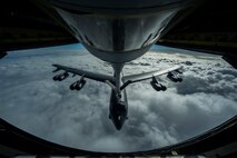 A B-52 Stratofortress is refueled in-flight April 2, 2014 over the Pacific Ocean near Joint Base Pearl Harbor-Hickam, Hawaii. This flight was in support of a mission in which two B-52 Stratofortress strategic bombers from Barksdale Air Force Base, La. and two B-2 Spirit strategic bombers from Whiteman Air Force Base, Mo., flew round trip non-stop from their respective home stations to training ranges in Hawaii. (U.S. Air Force photo by Staff Sgt. Nathan Allen)