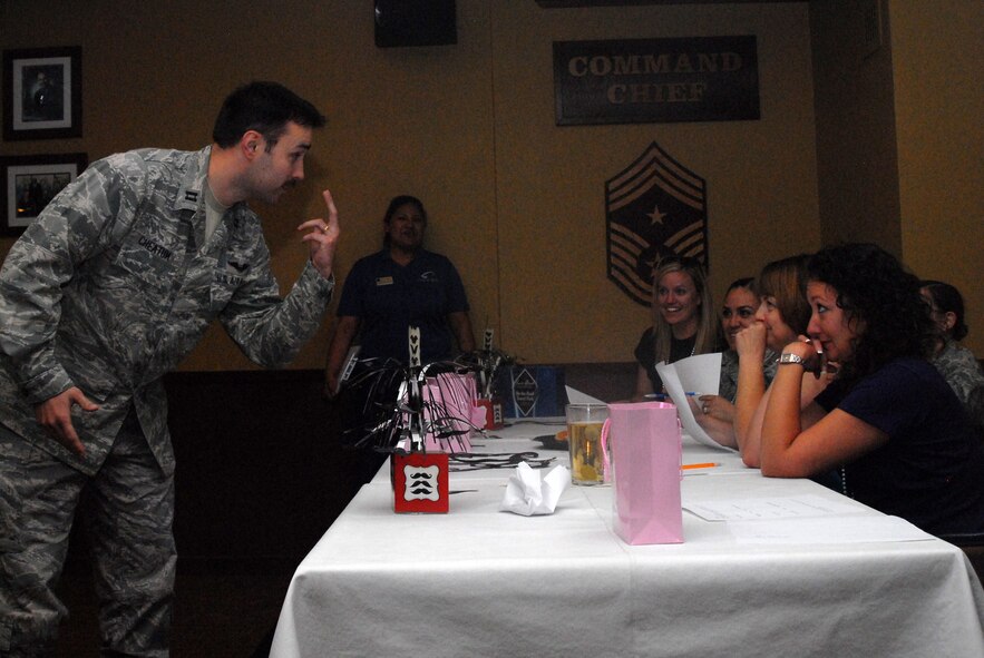 Capt. Myles Cheatum, 607th Air Control Squadron, shows the judges his upper lip March 28 during the Mustache March Social at Club Five Six. The social was held to celebrate the heritage of Mustache March and to allow Luke Air Force Base Airmen to have some fun. (U.S. Air Force photo/Senior Airman Devante Williams)