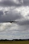 A B-52 Stratofortress strategic bomber conducts a low approach training flight over Joint Base Pearl Harbor-Hickam, Hawaii April 2, 2014. Two B-52 Stratofortress strategic bombers from Barksdale Air Force Base, La. and two B-2 Spirit strategic bombers from Whiteman Air Force Base, Mo., flew non-stop from their respective home stations to training ranges within the vicinity of Hawaii and conducted range training operations and low approach training flights at Hickam AFB. (U.S. Marine Corps photographs by Lance Cpl. Wesley Timm)