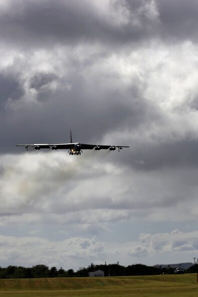 A B-52 Stratofortress strategic bomber conducts a low approach training flight over Joint Base Pearl Harbor-Hickam, Hawaii April 2, 2014. Two B-52 Stratofortress strategic bombers from Barksdale Air Force Base, La. and two B-2 Spirit strategic bombers from Whiteman Air Force Base, Mo., flew non-stop from their respective home stations to training ranges within the vicinity of Hawaii and conducted range training operations and low approach training flights at Hickam AFB. (U.S. Marine Corps photographs by Lance Cpl. Wesley Timm)