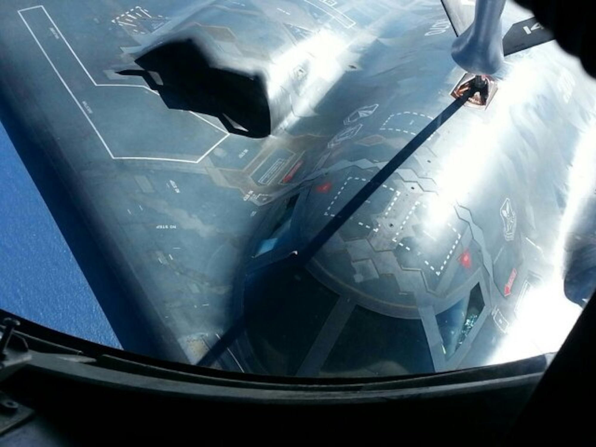 A KC-135 Stratotanker from Fairchild AFB, Wash., refuels a B-2 Spirit bomber from Whiteman AFB, Mo., April 2, 2014, during a non-stop flight from Missouri to training ranges in Hawaii to exercise the president’s credible and flexible military options to meet national security obligations to the U.S. and its allies and partners. Long-duration bomber missions test planners’ coordination capabilities while demonstrating U.S. Strategic Command’s strategic deterrence mission. (Courtesy photo)