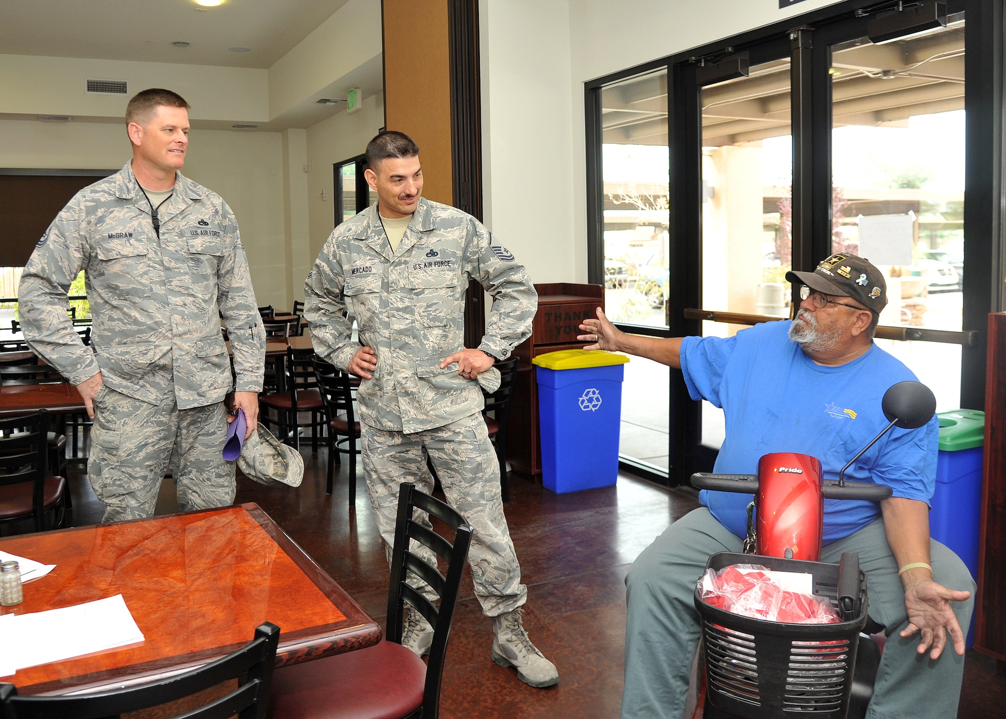 Master Sgt. Douglas McGraw and Master Sgt. Victor Mercado, 56th EMS, and Frank Sova, retired Army sergeant, talk about the veterans’ community. The Veterans in Progress work re-entry program has an 80 percent success rate in helping veterans return to the workplace, with more than 1,000 gaining full-time employment every year. (U.S. Air Force photo/Senior Airman Marcy Copeland)