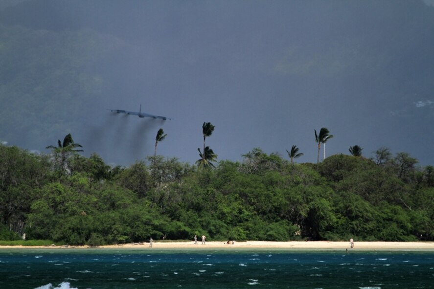 A B-52 Stratofortress strategic bomber conducts a low approach training flight over Joint Base Pearl Harbor-Hickam, Hawaii April 2, 2014.  Two B-52 Stratofortress strategic bombers from Barksdale Air Force Base, La. and two B-2 Spirit strategic bombers from Whiteman Air Force Base, Mo., flew non-stop from their respective home stations to training ranges within the vicinity of Hawaii and conducted range training operations and low approach training flights at Hickam AFB. (U.S. Marine Corps photographs by Staff Sgt. Jason W. Fudge)