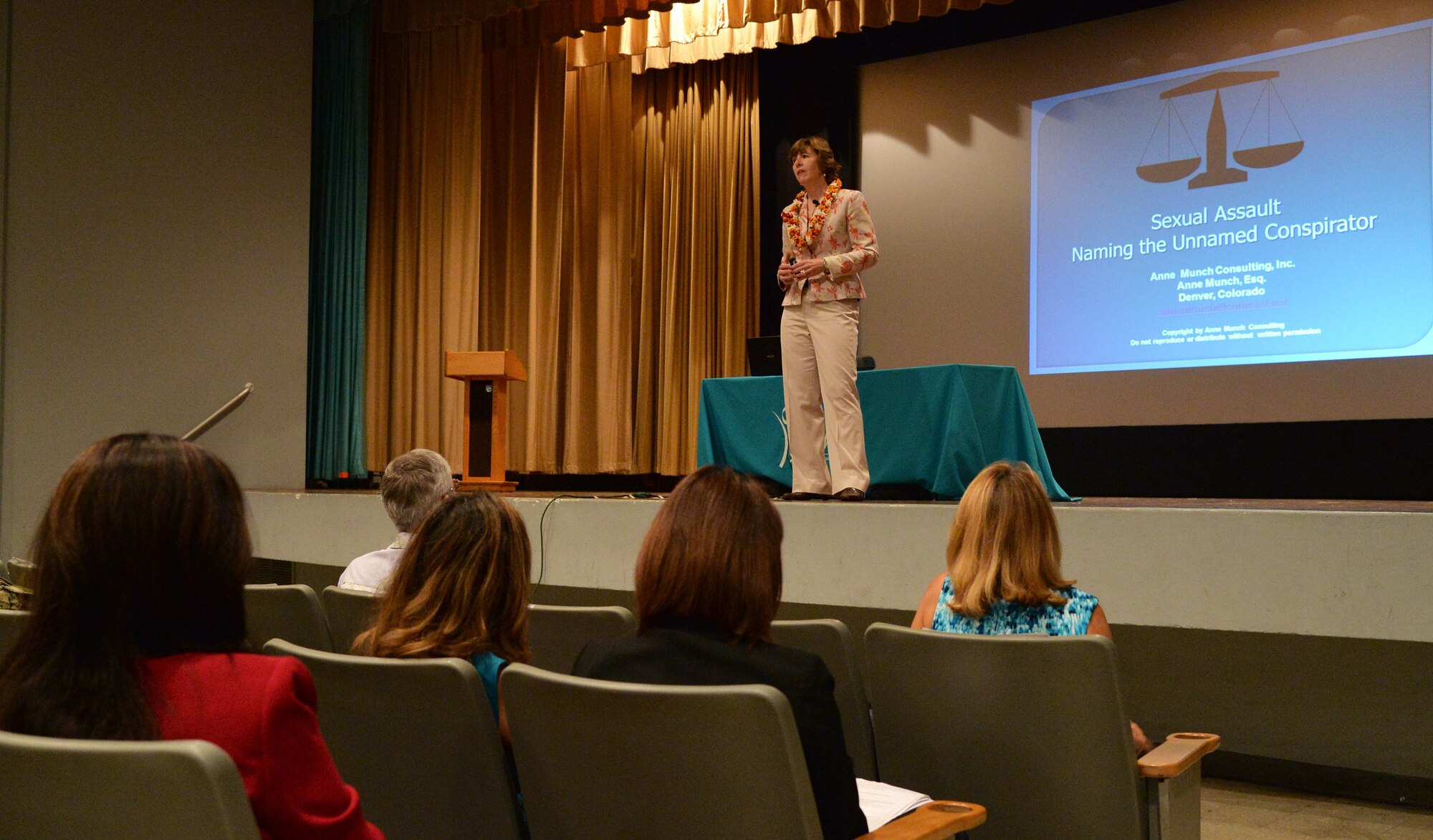 Anne Munch, a nationally acclaimed prosecutor and sexual assault expert, speaks to attendees of a Sexual Assault Awareness Month proclamation ceremony at Hickam Theater, Joint Base Pearl Harbor-Hickam, Hawaii, April 1, 2014. (U.S. Air Force photo/Staff Sgt. Alexander Martinez)