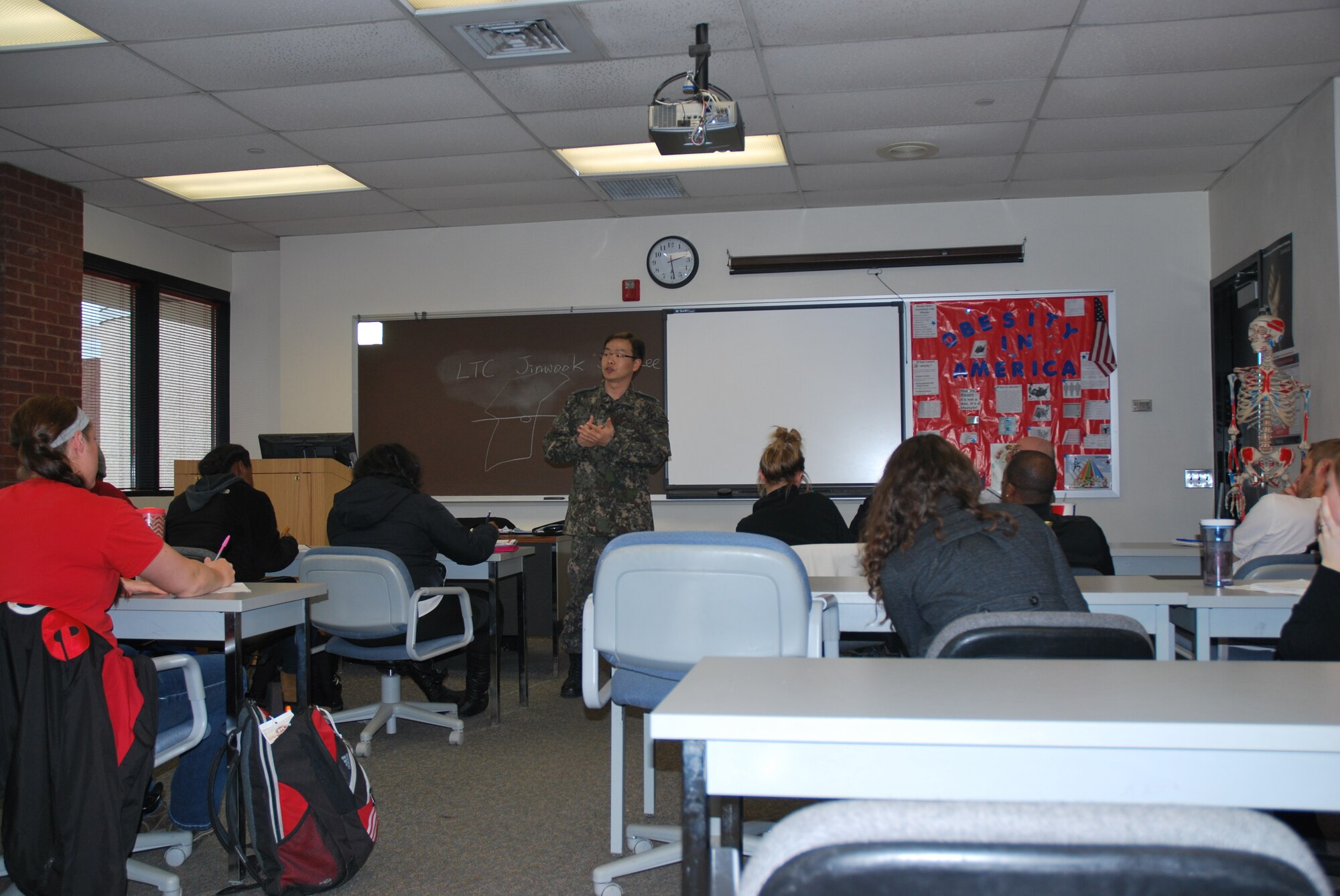 Foreign affairs experts speak to a class at Southern Illinois University Edwardsville about the political atmosphere and public health realities in North Korea. The speakers included, Kwang Kim, Deputy Foreign Policy Advisor, U.S. Transportation Command, Lt. Col. Jinwook Lee, the liason officer from the Republic of Korea to USTRANSCOM and Mike Brogan who works in the international affairs section of the Strategy, Policy, and Logistics Office at USTRANSCOM. The group spoke to students March 27, during SIUE's Global Awareness Week. (U.S. Army photo/Sarah Garner)


