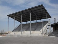 JOINT BASE SAN ANTONIO-LACKLAND, Texas -- The new Recruit Family In-processing and Information Center facility, also known as the "Gateway to the Air Force," features a 1,000-person indoor auditorium, with additional outdoor seating for up to 2,000 visitors, to accommodate training and ceremonial activities. The facility is the first thing Air Force recruits will see when arriving for basic training.  (U.S. Air Force photo/Mandy Mullen)