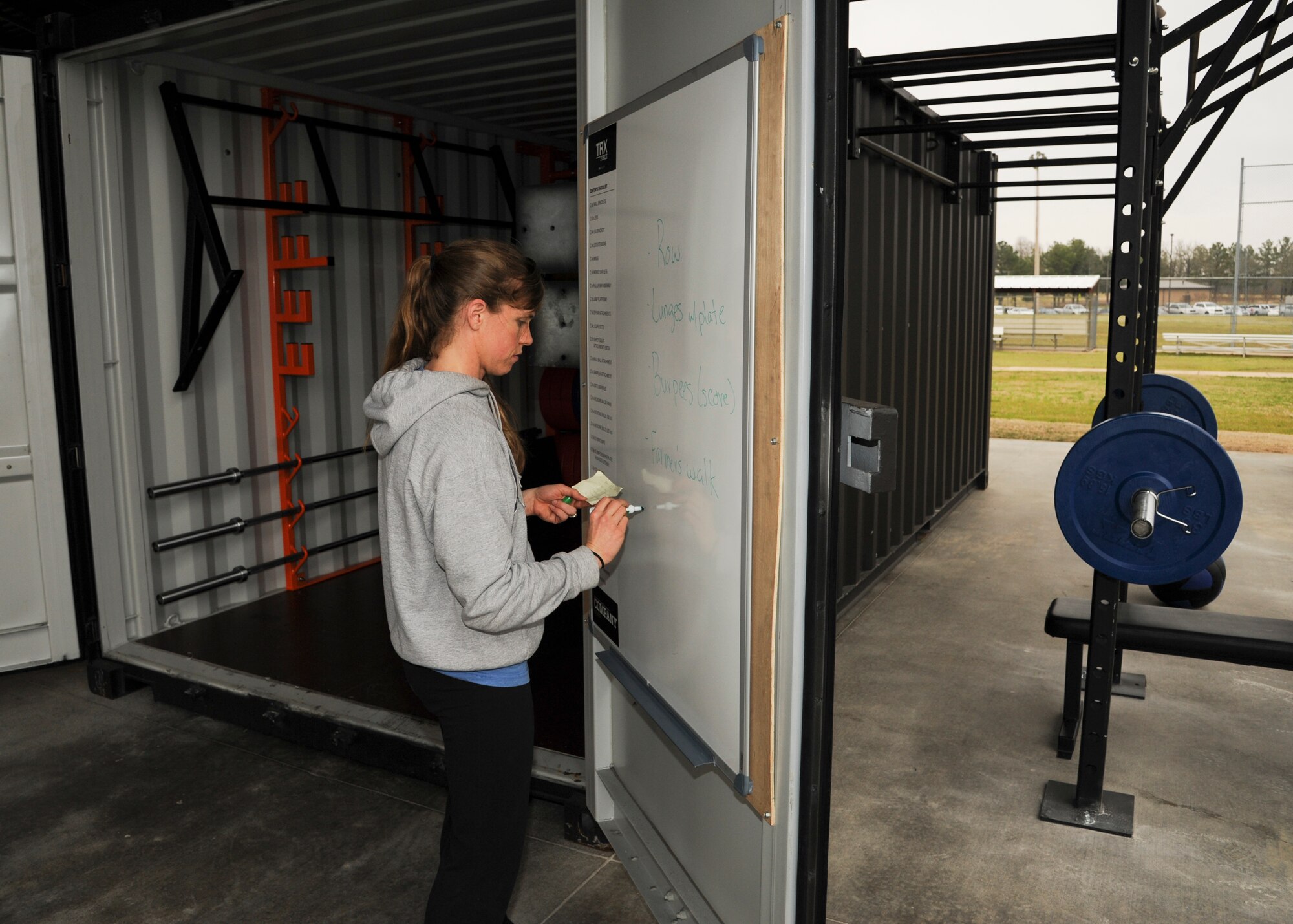 Lindsay Burks, 19th Aerospace Medicine Squadron health fitness specialist, writes down the agenda for a Vital 90 exercise class April 2, 2014, at Little Rock Air Force Base, Ark. Burks was utilizing the new exercise equipment now available at the WarFit Pavilion (Bldg. 792).  (U.S. Air Force photos by Airman 1st Class Harry Brexel) 