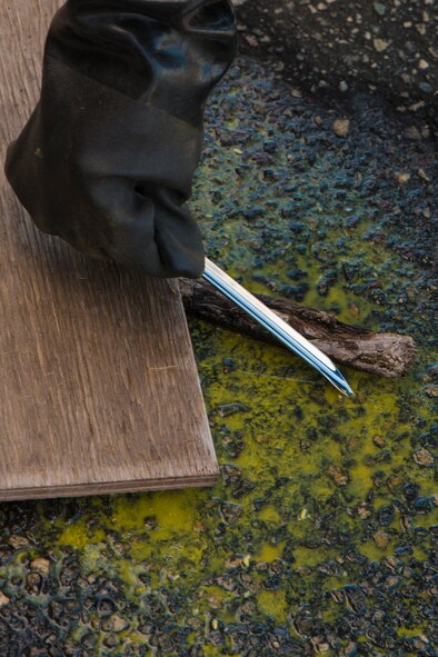 An Airman tests an unknown chemical during a chemical, biological, radiological and nuclear major accident response exercise at Moody Air Force Base, Ga., April 3, 2014. Determining the specific chemical agent is critical to how emergency response personnel react. (U.S. Air Force photo by Airman 1st Class Ryan Callaghan/Released)