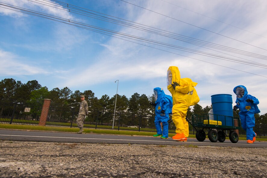 A biohazard response team walks toward the scene of a chemical attack during a chemical, biological, radiological and nuclear major accident response exercise at Moody Air Force Base, Ga., April 3, 2014. Once all the casualties were safely removed from the scene, the biohazard team carefully controlled the chemical agent to ensure no further spread. (U.S. Air Force photo by Airman 1st Class Ryan Callaghan/Released)