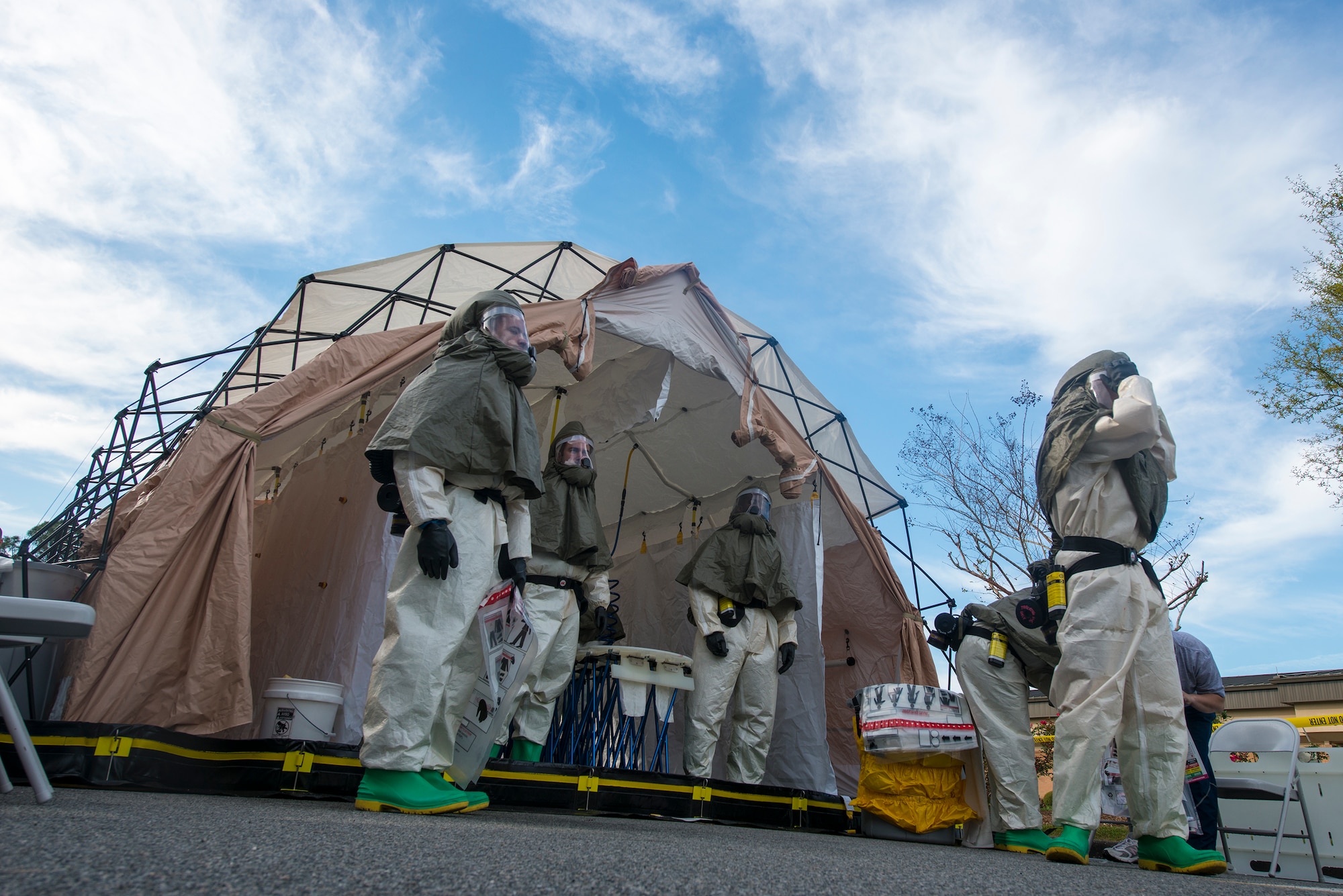 Airmen wait for patients to arrive to a decontamination site outside the medical treatment facility (MTF) during a chemical, biological, radiological and nuclear major accident response exercise at Moody Air Force Base, Ga., April 3, 2014. Upon arrival to the MTF, 23d Medical Group personnel thoroughly decontaminated patients prior to giving treatment. (U.S. Air Force photo by Airman 1st Class Ryan Callaghan/Released)