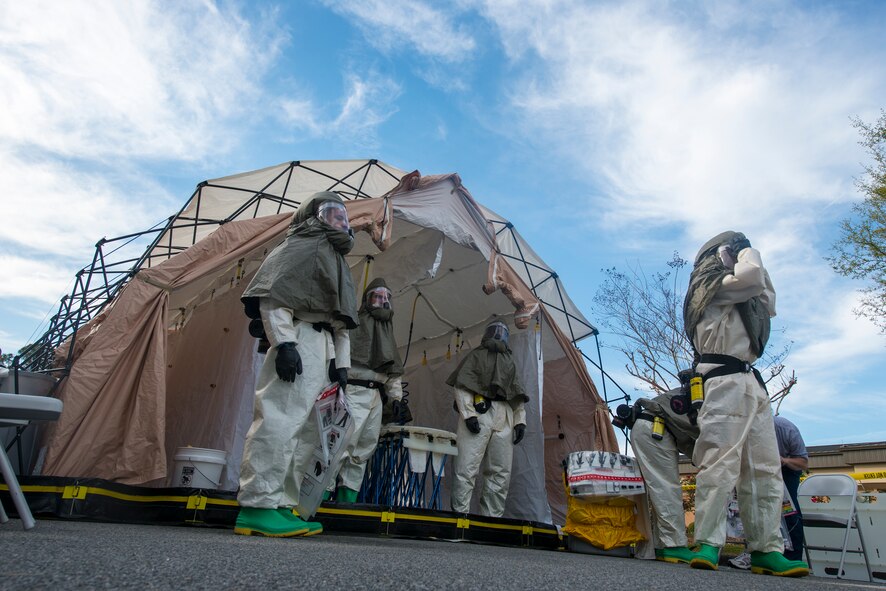 Airmen wait for patients to arrive to a decontamination site outside the medical treatment facility (MTF) during a chemical, biological, radiological and nuclear major accident response exercise at Moody Air Force Base, Ga., April 3, 2014. Upon arrival to the MTF, 23d Medical Group personnel thoroughly decontaminated patients prior to giving treatment. (U.S. Air Force photo by Airman 1st Class Ryan Callaghan/Released)