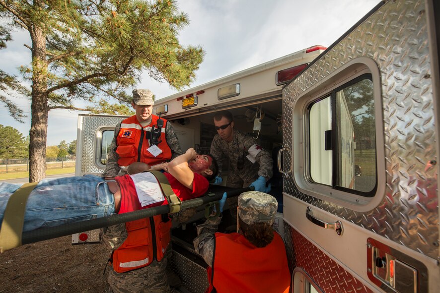 Airmen load a patient into an ambulance during a chemical, biological, radiological and nuclear major accident response exercise at Moody Air Force Base, Ga., April 3, 2014. The exercise was conducted as a part of Moody’s first unit effectiveness inspection. (U.S. Air Force photo by Airman 1st Class Ryan Callaghan/Released)