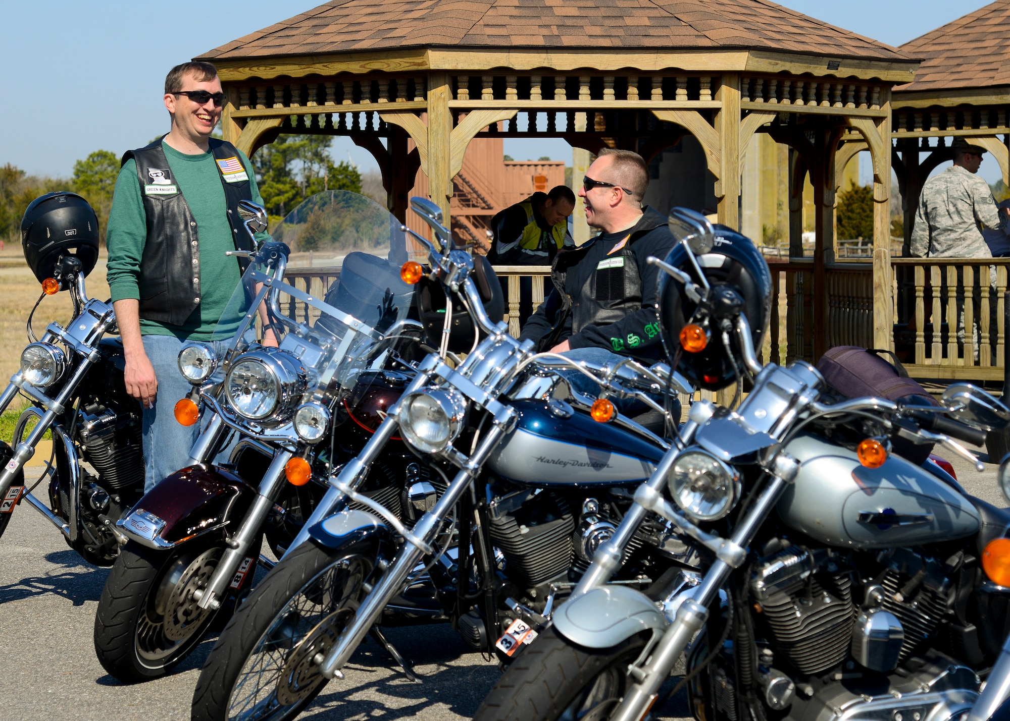 U.S. Air Force Master Sgt. Michael, 30th Intelligence Squadron deputy operations supervisor, and Senior Master Sgt. Todd, 497th Intelligence, Surveillance and Reconnaissance Group supervisor of plans and programs, show off their motorcycles at the third annual Motorcycle Safety Day at Langley Air Force Base, Va., April 2, 2014. The event educated motorcycle riders about safe practices and regulations before the upcoming season. (U.S. Air Force photo by Airman 1st Class Victoria H. Taylor/Released) (The last names of the subjects are withheld for security purposes)