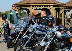 U.S. Air Force Master Sgt. Michael, 30th Intelligence Squadron deputy operations supervisor, and Senior Master Sgt. Todd, 497th Intelligence, Surveillance and Reconnaissance Group supervisor of plans and programs, show off their motorcycles at the third annual Motorcycle Safety Day at Langley Air Force Base, Va., April 2, 2014. The event educated motorcycle riders about safe practices and regulations before the upcoming season. (U.S. Air Force photo by Airman 1st Class Victoria H. Taylor/Released) (The last names of the subjects are withheld for security purposes)