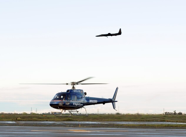 A helicopter flown by Enloe Emergency Services personnel prepares to land on the flightline at Beale Air Force Base, Calif., April 2, 2014. Beale Airmen participated in an exercise with Enloe to gain experience loading patients onto emergency helicopters. (U.S. Air Force photo by Airman 1st Class Bobby Cummings/Released)