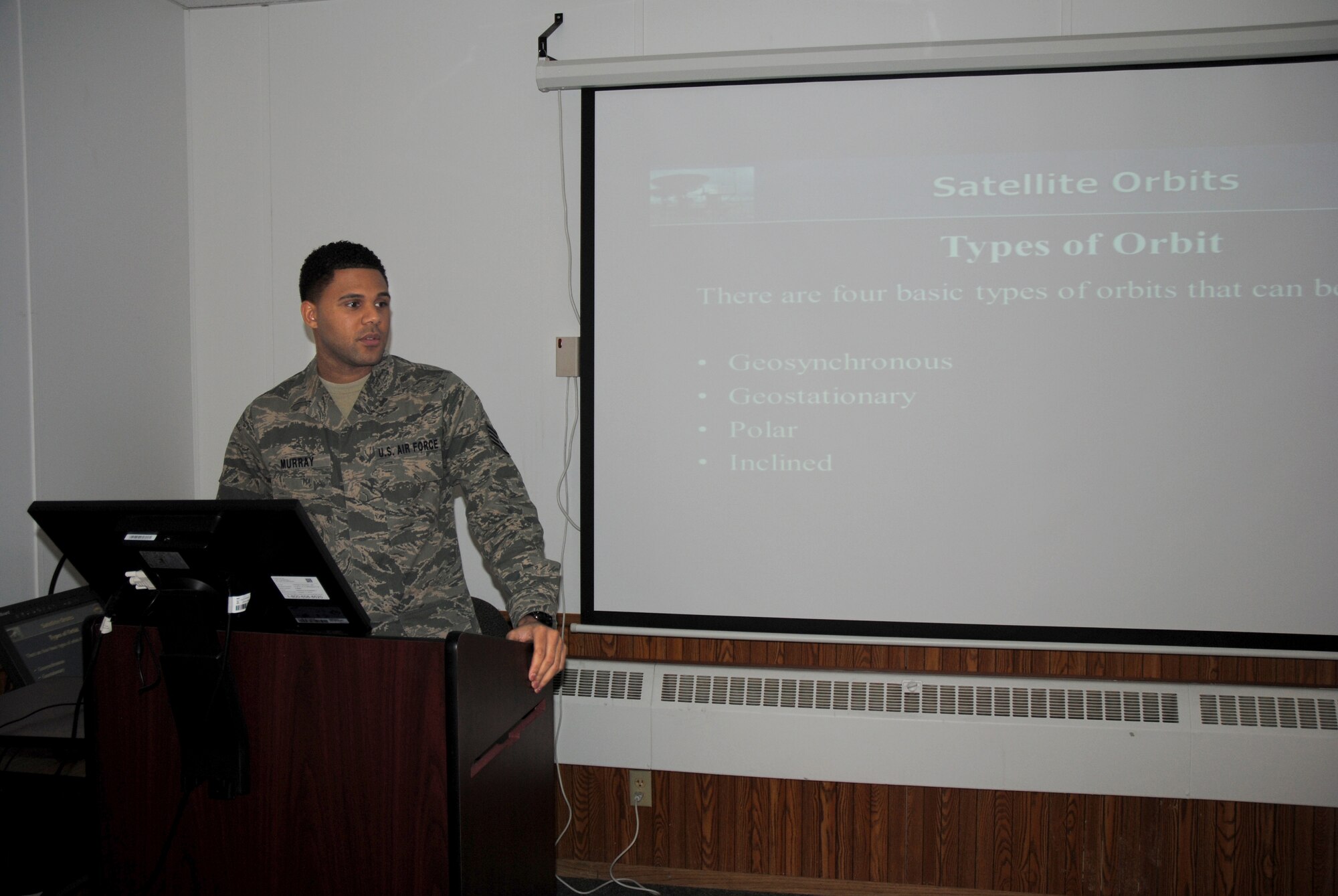 Staff Sgt. Mark Murray, 372nd Training Squadron, Detachment 27 RQ-4 tactical field terminal instructor, teaches a class on the four types of satellite orbits April 2, 2014, at Grand Forks Air Force Base, N.D. Murray completed a course on satellite, wideband and telemetry systems by attending technical school training at Keesler Air Force Base, Miss., and Fort Gordon, Ga. He has more than five years of active-duty service in the Air Force. (U.S. Air Force photo/Staff Sgt. Luis Loza Gutierrez)
