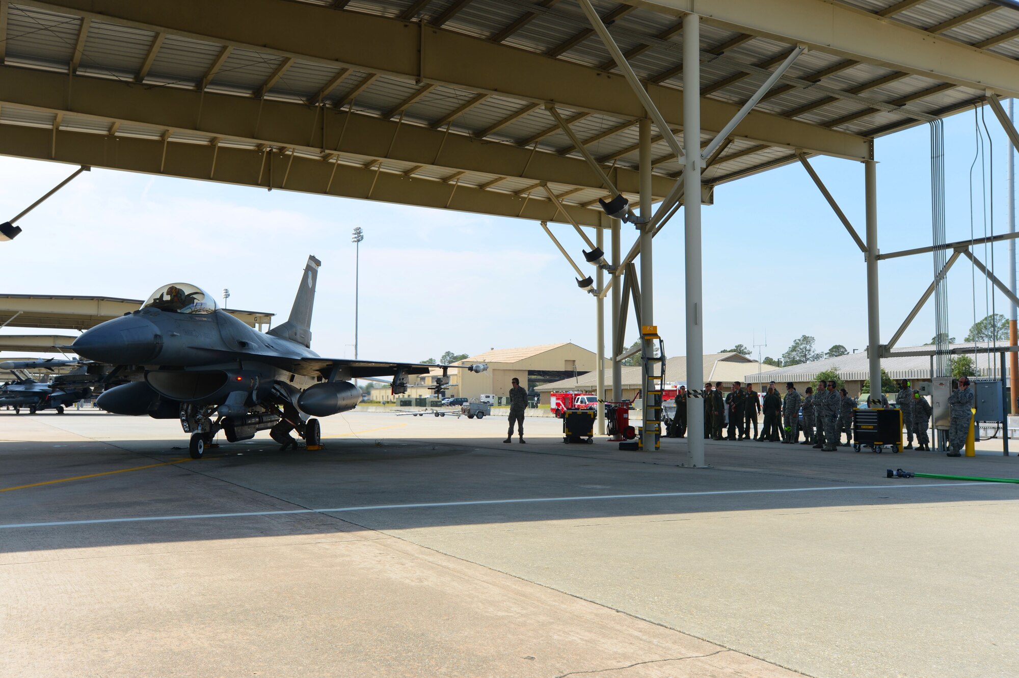 U.S. Air Force Col. Clark Quinn, 20th Fighter Wing vice commander, returns from his final flight, April 3, 2014, at Shaw Air Force Base, S.C. Co-workers greeted Quinn after his final flight here. (U.S. Air Force photo by Airman 1st Class Jensen Stidham/Released)