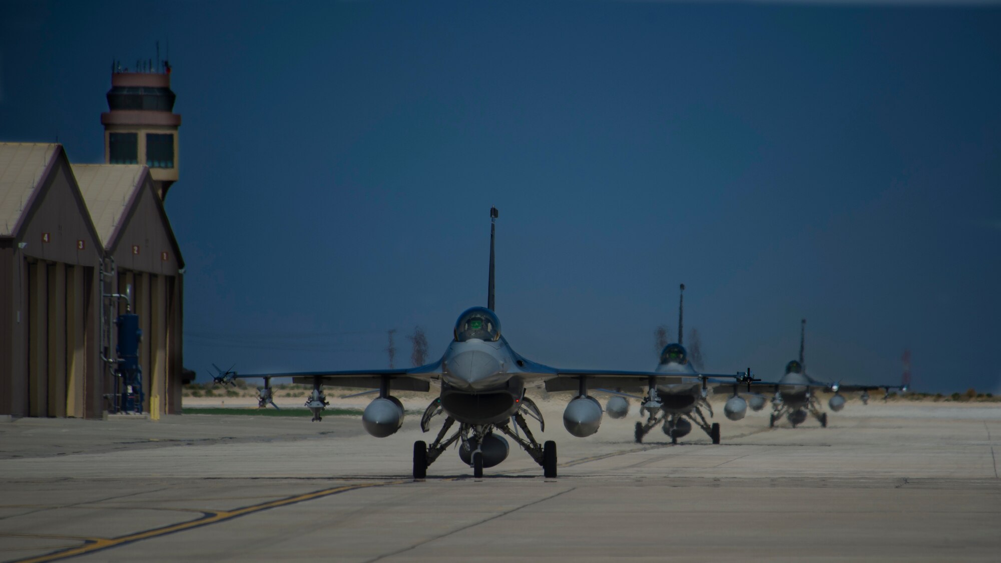 The 54th Fighter Group, a tenant unit of the 56th Fighter Wing at Luke Air Force Base, Ariz., received its first three-ship formation of F-16 Fighting Falcons at Holloman Air Force Base, N.M., April 1. The 54th Fighter Group will operate two F-16 training squadrons at Holloman by the end of 2015. (U.S. Air Force photo by Airman 1st Class Aaron Montoya / Released)