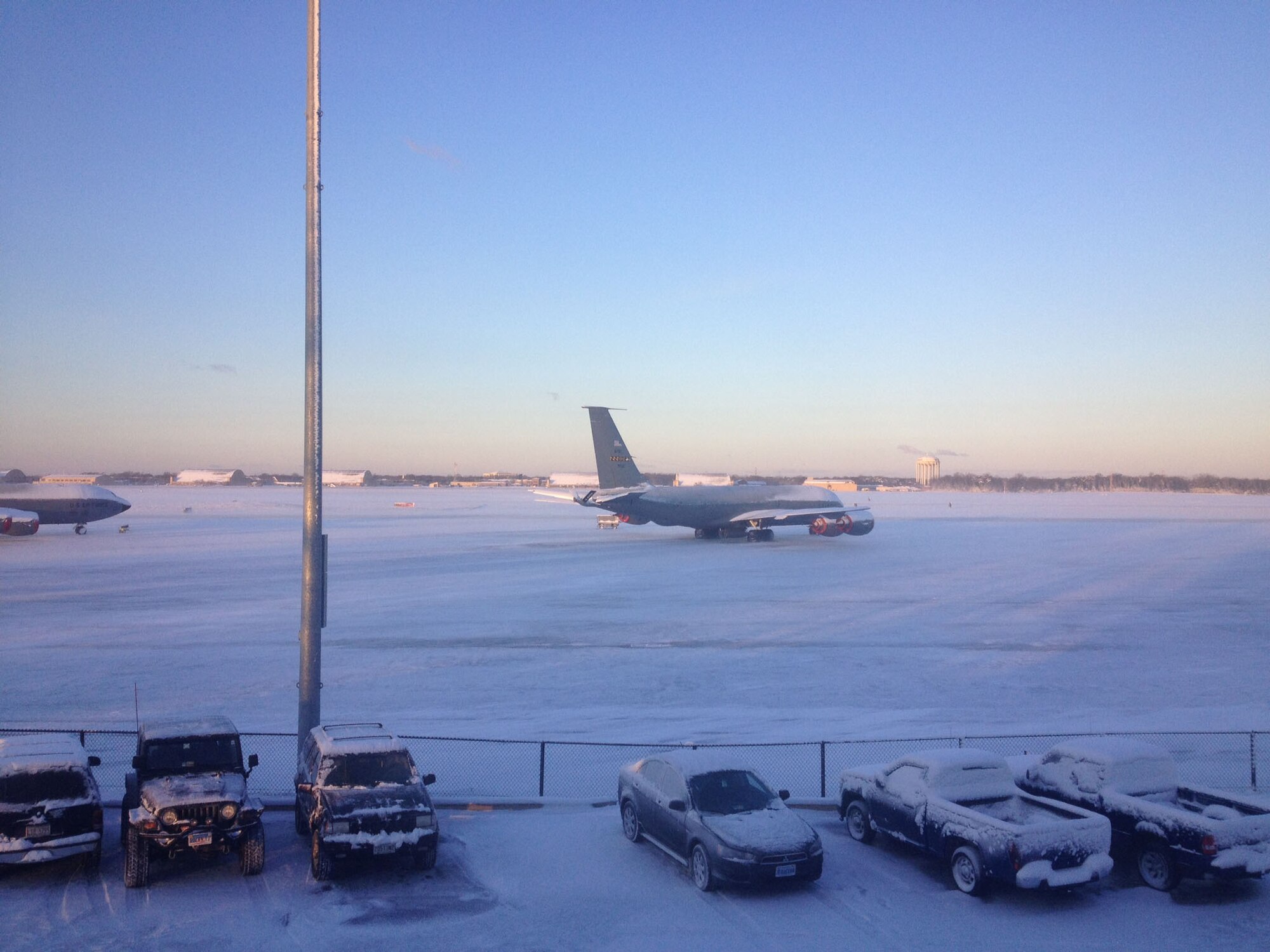 A KC-135 Stratotanker sits on a snow-covered flightline after a winter storm at the 459th Air Refueling Wing, Joint Base Andrews, Md., Jan. 3, 2014. Snow has fallen 15 times during the season, making this the fourth snowiest winter in 25 years. (U.S. Air Force photo/ Tech. Sgt. Jason Wesche)