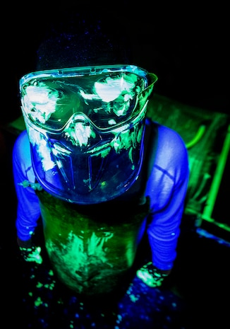 Airman 1st Class Henry Paulk, 437th Maintenance Squadron non-destructive inspector, is required to wear a protective mask, apron and gloves when handling aircraft parts that have been sprayed with a dye to prevent any of the liquid from getting  on his skin or in his eyes, March 8, 2014, at Joint Base Charleston, S.C. The 437th MXS NDI shop inspects metal objects ranging from nuts and bolts, to large hooks and sheets of metal. (U.S. Air Force photo/Senior Airman Dennis Sloan)