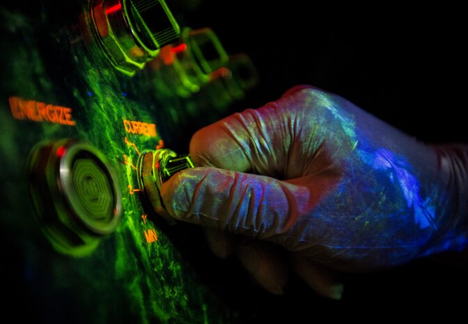 Tech. Sgt. Ryan Michalec, 437th Maintenance Squadron non-destructive inspector, turns a current on that will help reveal any cracks that may exist on aircraft parts March 8, 2014, at Joint Base Charleston, S.C. The 437th MXS NDI shop inspects metal objects ranging from nuts and bolts, to large hooks and sheets of metal. (U.S. Air Force photo/Senior Airman Dennis Sloan)