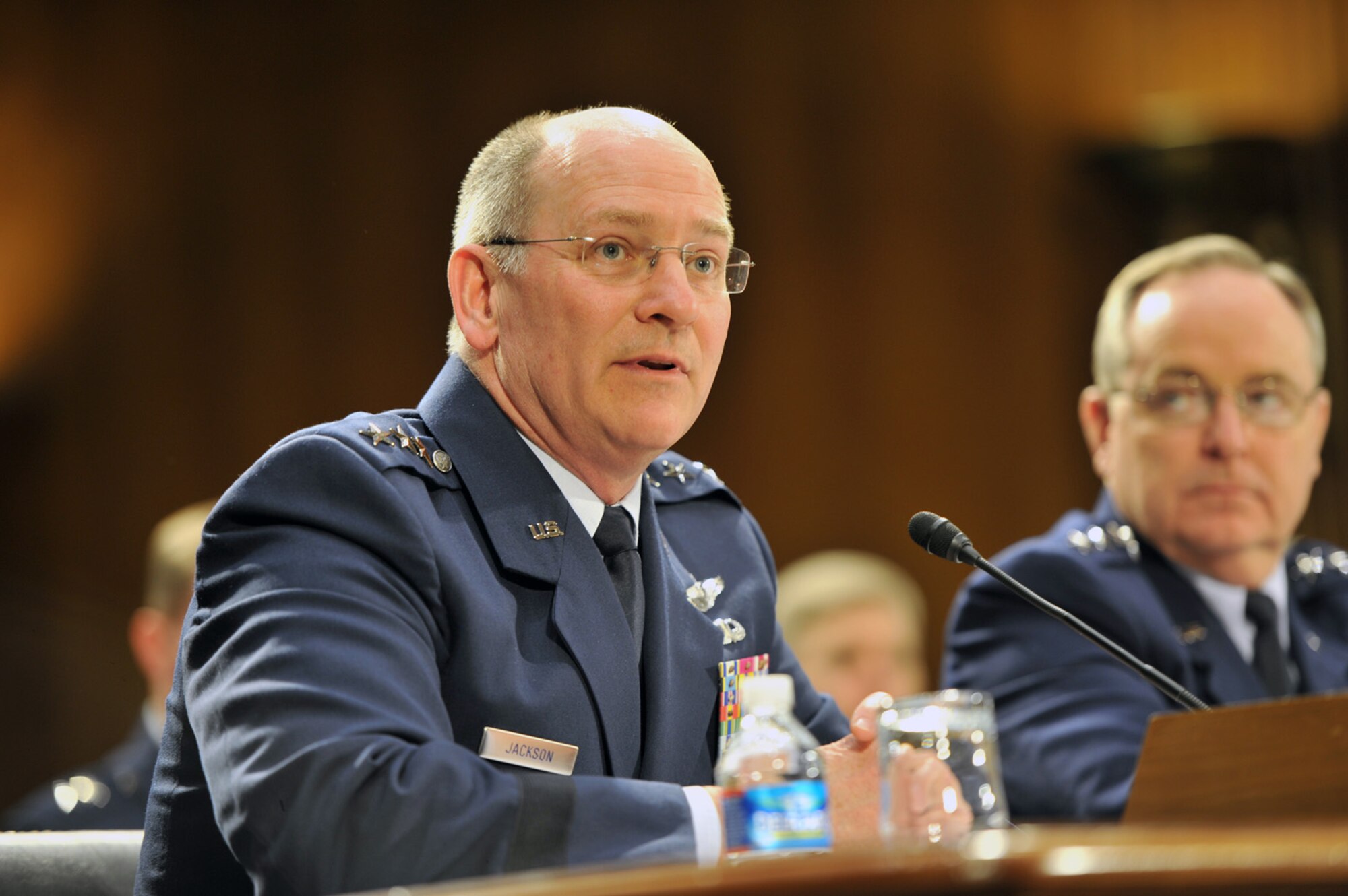 Lt. Gen. James F. Jackson, chief of Air Force Reserve, testifies April 2, 2014, at a hearing on the posture of the Air Force, Air National Guard and Air Force Reserve before the Senate Appropriations Committee Subcommittee on Defense. Air Force Chief of Staff Gen. Mark A. Welsh III, right, listens as Jackson speaks. (U.S. Army National Guard photo/Sgt. 1st Class Jim Greenhill)
