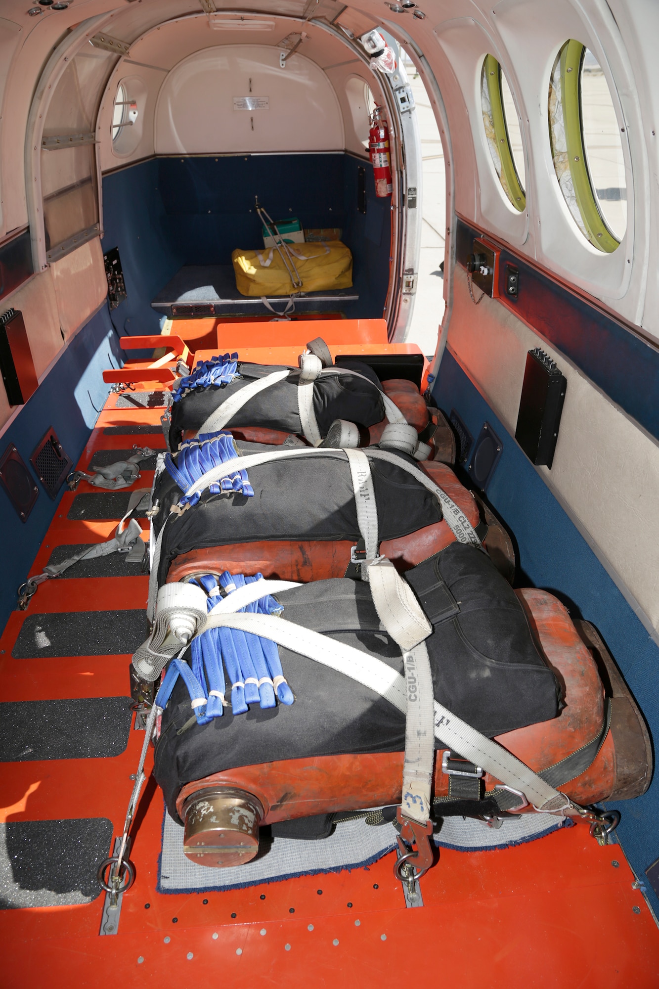 Three dummies weighing between 185 and 350 pounds were secured inside a C-12C on Mar. 10 as part of a Test Management Project through the U.S. Air Force Test Pilot School in order to come up with a more cost-effective way of conducting dummy drop parachute testing for the Air Force. (U.S. Air Force photo by Christian Turner)