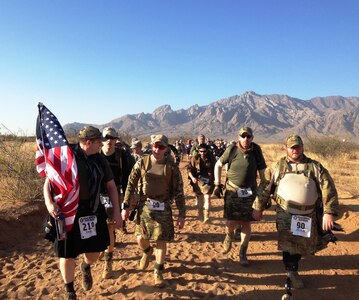 Participants at the Bataan Memorial Death March on Sunday March 23, 2014 in the White Sands Missile Range, New Mexico. The Bataan Memorial Death March honors a group of World War II heroes, who defended the islands of Luzon, Corregidor and the harbor defense forts of the Philippines in 1942. After being captured by the Japanese forces, these Army, Army Air Corps, Navy, Marines, and National Guard heroes, survived on half or quarter rations and outdated equipment during the 80 mile march.The soldiers were responsible for the defense of the islands of Luzon, Corregidor and the harbor defense forts of the Philippines. 