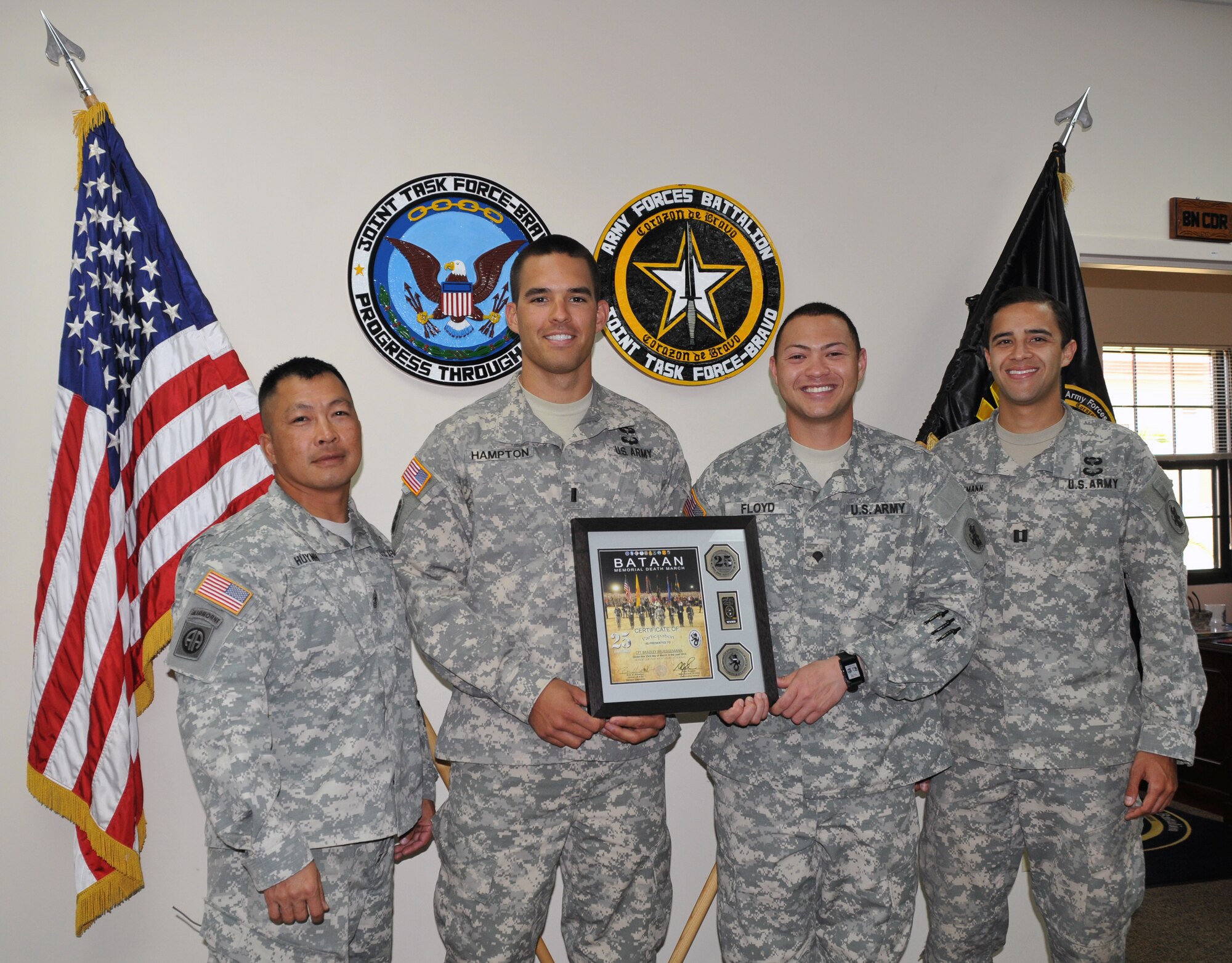 From left to right, U.S. Army 1st Sgt. Thinh Huynh, U.S. Army 1st Lt. Spencer Hampton, U.S. Army Spc. Christopher Floyd, U.S. Army Capt. Bradley Brueggemann.  Four members of Joint Task Force-Bravo’s Army Forces Battalion (ARFOR) in Soto Cano Air Base, Honduras, completed the Bataan Memorial Death March on Sunday March 23, 2014 in the White Sands Missile Range, New Mexico. 
The Bataan Memorial Death March honors a group of World War II heroes, who defended the islands of Luzon, Corregidor and the harbor defense forts of the Philippines in 1942. After being captured by the Japanese forces, these Army, Army Air Corps, Navy, Marines, and National Guard heroes, survived on half or quarter rations and outdated equipment during the 80 mile march.The soldiers were responsible for the defense of the islands of Luzon, Corregidor and the harbor defense forts of the Philippines. 