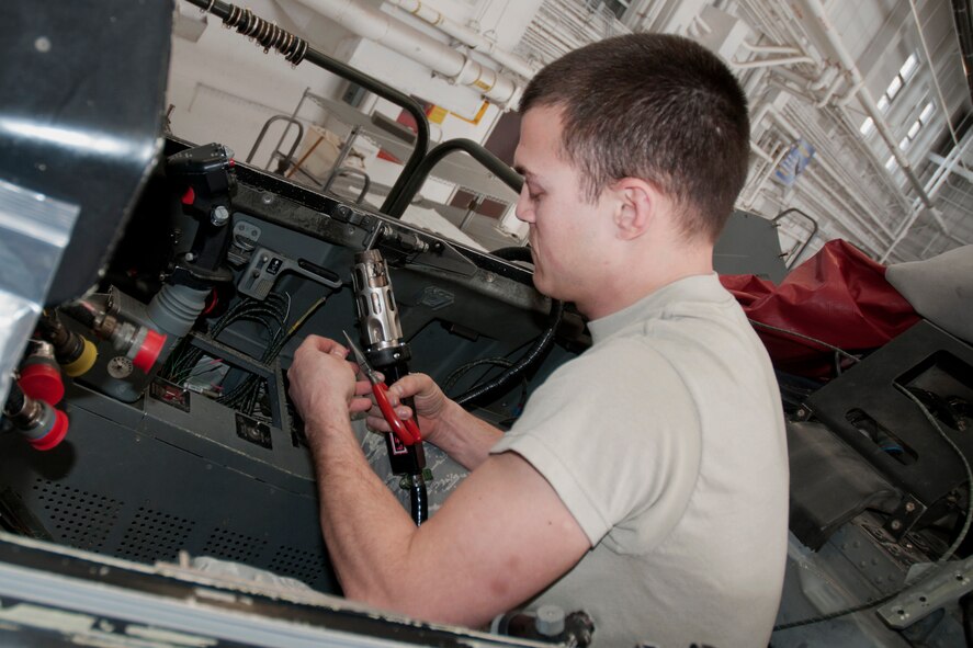 Staff Sgt. Erik Johansen conducts avionics upgrades on an F-16 aircraft in the hangar of the 132nd Fighter Wing (132FW), Des Moines, Iowa on Sunday, March 2, 2014.  The 132FW has been selected to assist with this process, called a “Speed Line”, rather than sending the F-16s to Hill Air Force Base as previously done in the past; this saves approximately $100,000.00 per aircraft.  (U.S. Air National Guard photo by Staff Sgt. Linda K. Burger/Released)