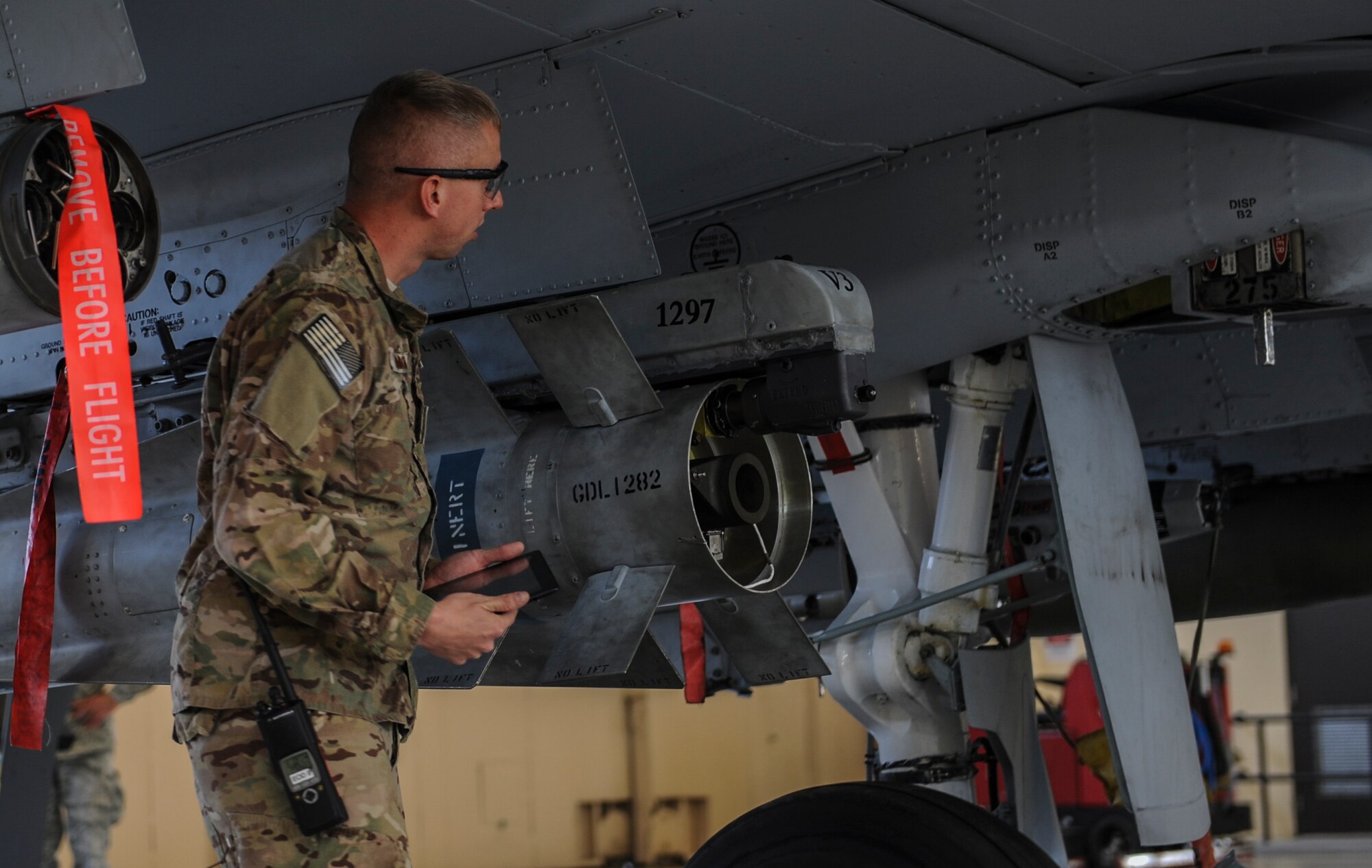 U.S. Air Force Tech. Sgt. Stanley Thompson, 23d Civil Engineer Squadron NCO in charge of explosive ordnance disposal (EOD) operations, searches for a magazine during an exercise at Moody Air Force Base, Ga., April 1, 2014. Thompson participated in a portion of the 23d Wing unit effectiveness inspection. (U.S. Air Force photo by Airman 1st Class Alexis Millican/Released)