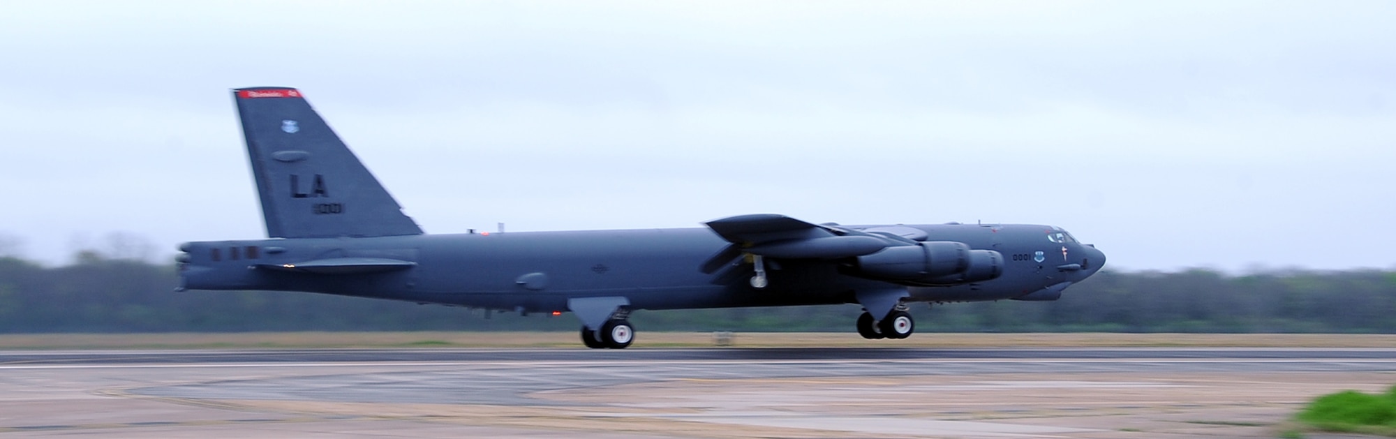 A B-52H Stratofortress assigned to 96th Bomb Squadron picks up speed for take-off at Barksdale Air Force Base, La., April 2, 2014. Two B-52s from Barksdale and two B-2 Spirit strategic bombers from Whiteman Air Force Base, Mo., flew non-stop from their respective home stations to conduct range training operations and low approach training flights within the vicinity of Hawaii, April 2, 2014. The training flights of approximately 20 and 21 hours in duration, ensure U.S. strategic bomber forces maintain a high state of readiness and demonstrate U.S. Strategic Command's ability to provide a bomber force that is flexible, credible, and always ready to respond to a variety of threats and situations around the world. (U.S. Air Force photo/Staff Sgt. Jason McCasland)