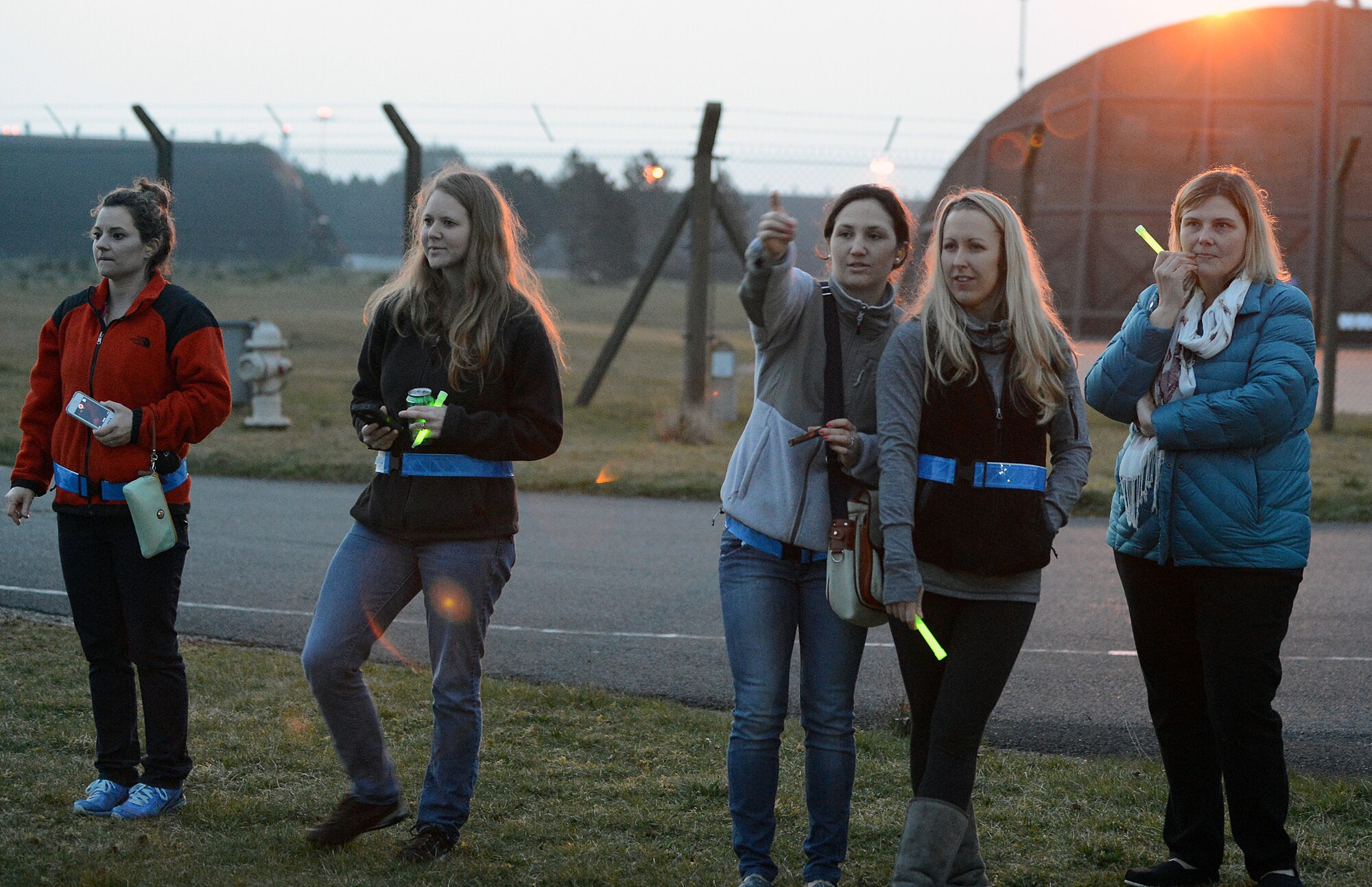Some wives from the 492nd Fighter Squadron watch their husbands depart for a deployment from Royal Air Force Lakenheath, England, April 1, 2014. The 492nd FS will be deployed to the U.S. Central Command area of responsibility for six months. (U.S. Air Force photo by Airman 1st Class Trevor T. McBride)
