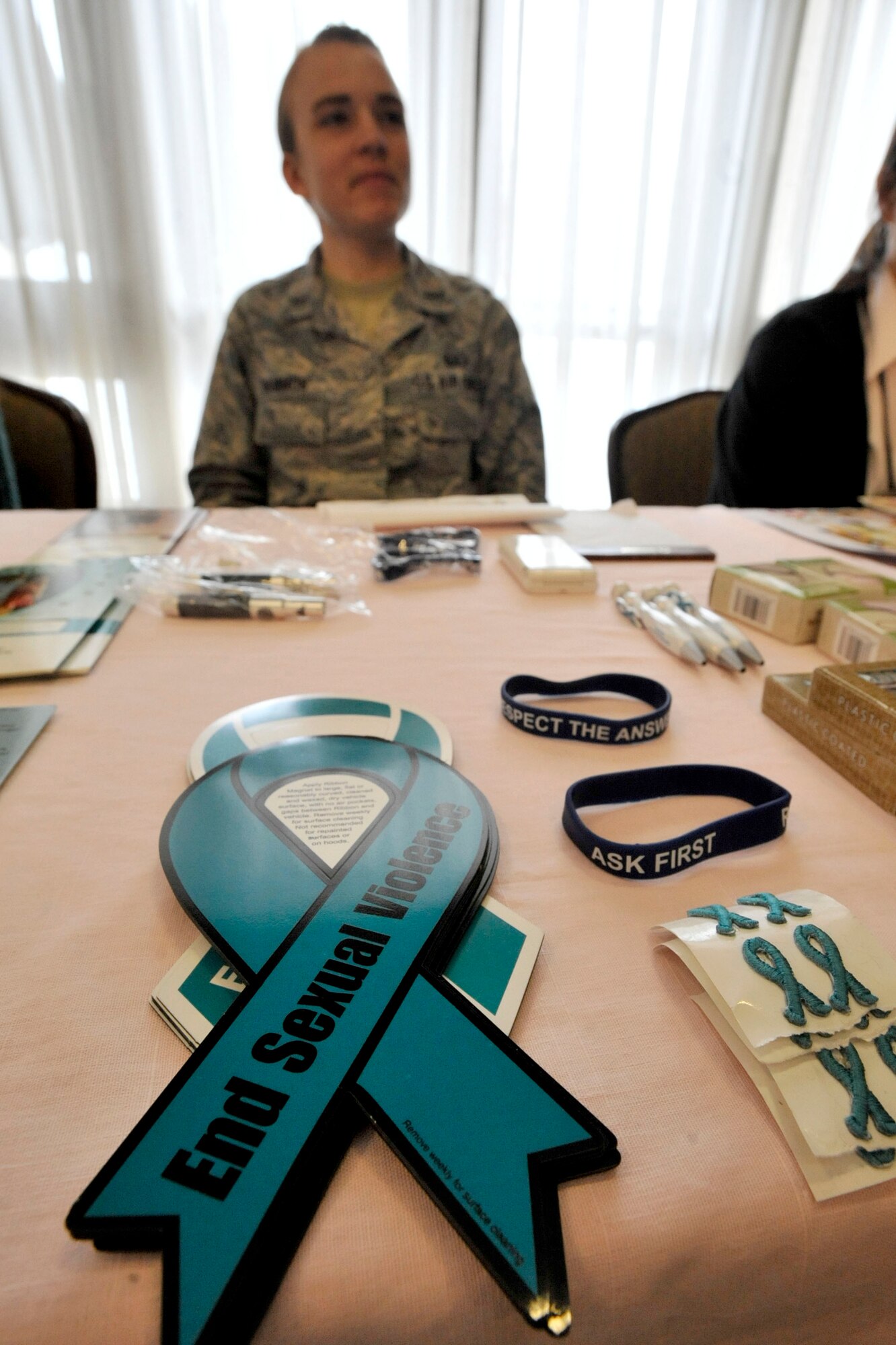 MISAWA AIR BASE, Japan – 1st Lt. Aimee Hammon, 35th Fighter Wing deputy sexual assault response coordinator, informs Airmen and their family members about sexual assault prevention in the Misawa Collocated Club, at Misawa Air Base, March 26, 2014. With April as Sexual Assault Awareness Month, the SARC is seeking to recruit new victim advocates. (U.S. Air Force photo/ Staff Sgt. Tong Duong)