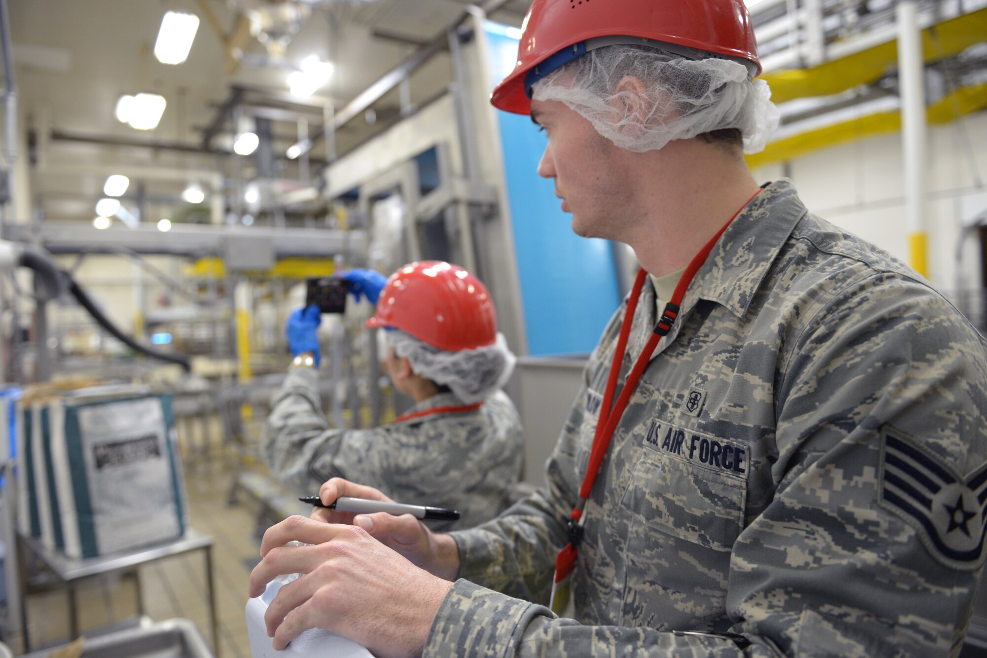 (Right to left) Staff Sgt. Wesley Barlow, 374th Aerospace Medicine Squadron noncommissioned officer in charge of environmental protection, and Tech. Sgt. Norma Grandberry, 374th Medical Group NCO in charge of education and training, measure water pH at Yokota Air Base, Japan, April 1, 2014. Grandberry is training for an independent duty medical technician certification test.  (U.S. Air Force photo by Airman 1st Class David Danford/Released)