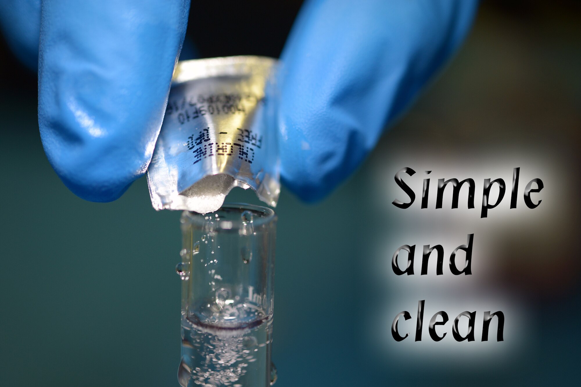 A packet of chlorine reagent is added to a test tube of water at Yokota Air Base, Japan, March 31, 2014. (U.S. Air Force graphic by Airman 1st Class David Danford/Released)