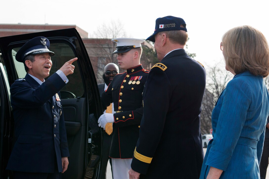 U.S. Army Gen. Martin E. Dempsey, center, chairman of the Joint Chiefs of Staff, greets 
Gen. Shigeru Iwasaki, chief of the joint staff for Japan's Self Defense Forces, during the Japan Defense Chiefs Strategy Dialogue at the National War College on Fort Lesley J. McNair in Washington, D.C., April 3, 2014.