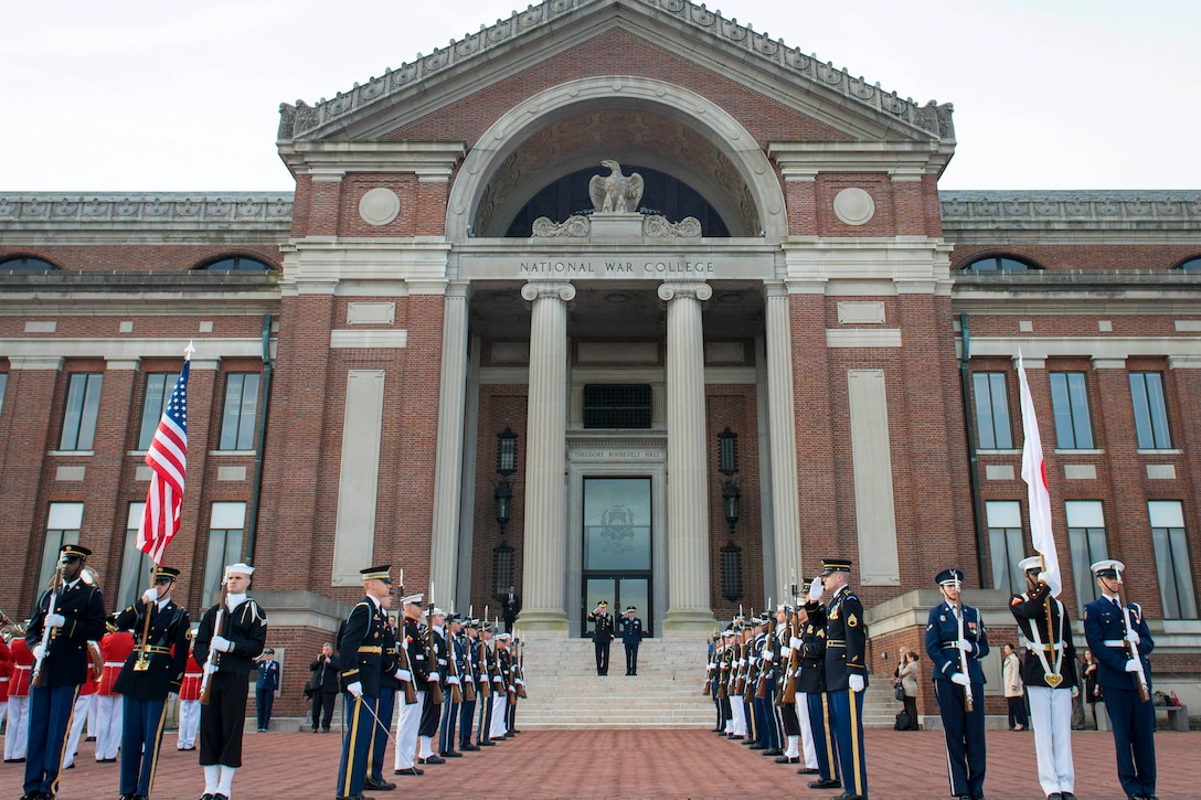 U.S. Army Gen. Martin E. Dempsey, left, chairman of the Joint Chiefs of Staff, and Gen. Shigeru Iwasaki, chief of the joint staff for Japan's Self Defense Forces, salute as the national anthems of both countries play during the Japan Defense Chiefs Strategy Dialogue at National War College on Fort Lesley J. McNair in Washington, D.C., April 3, 2014.